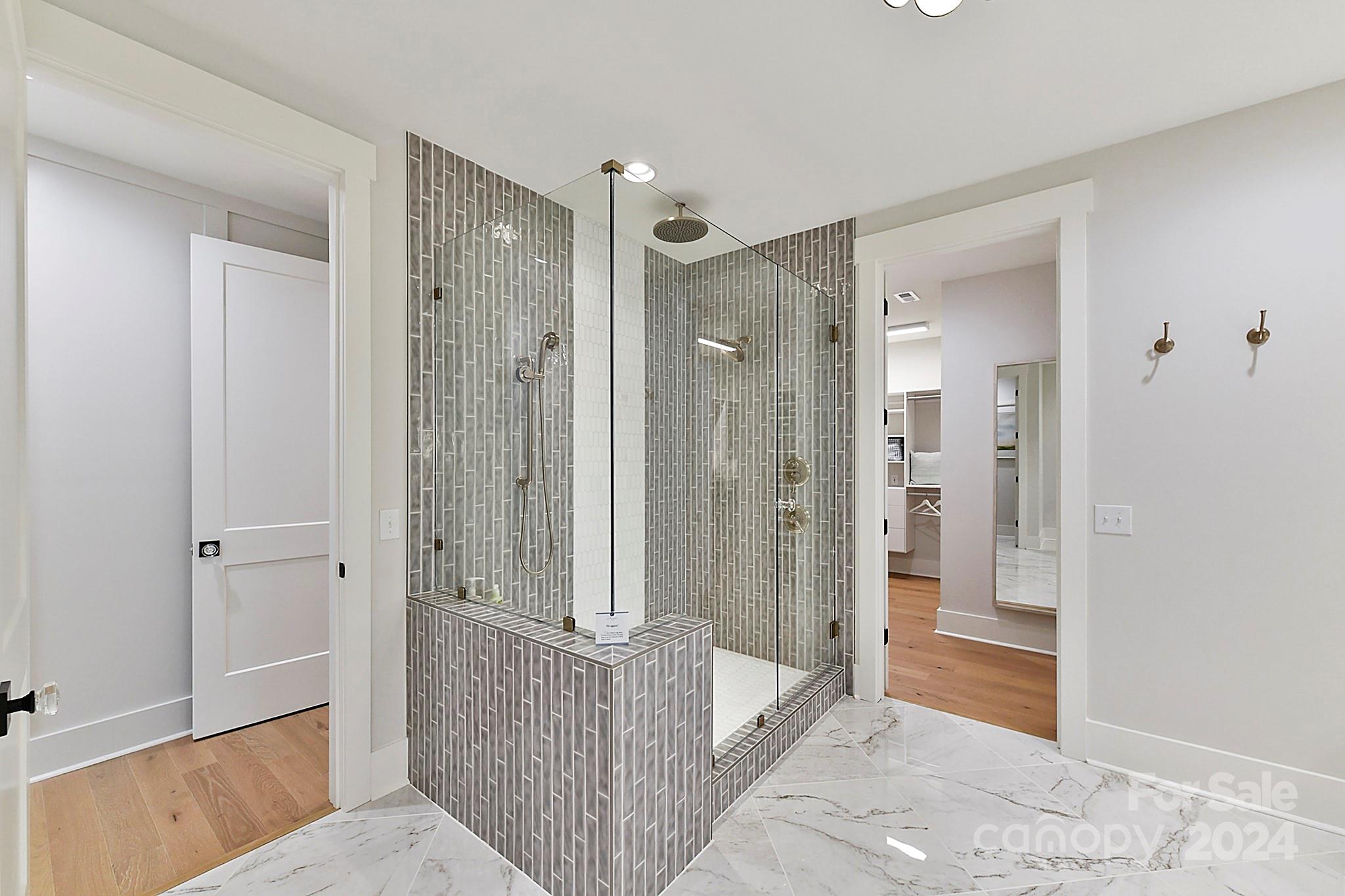 335 Bubbling Well Road Matthews, NC 28105 - Photo 18 of 48 a bathroom with a shower and a tub