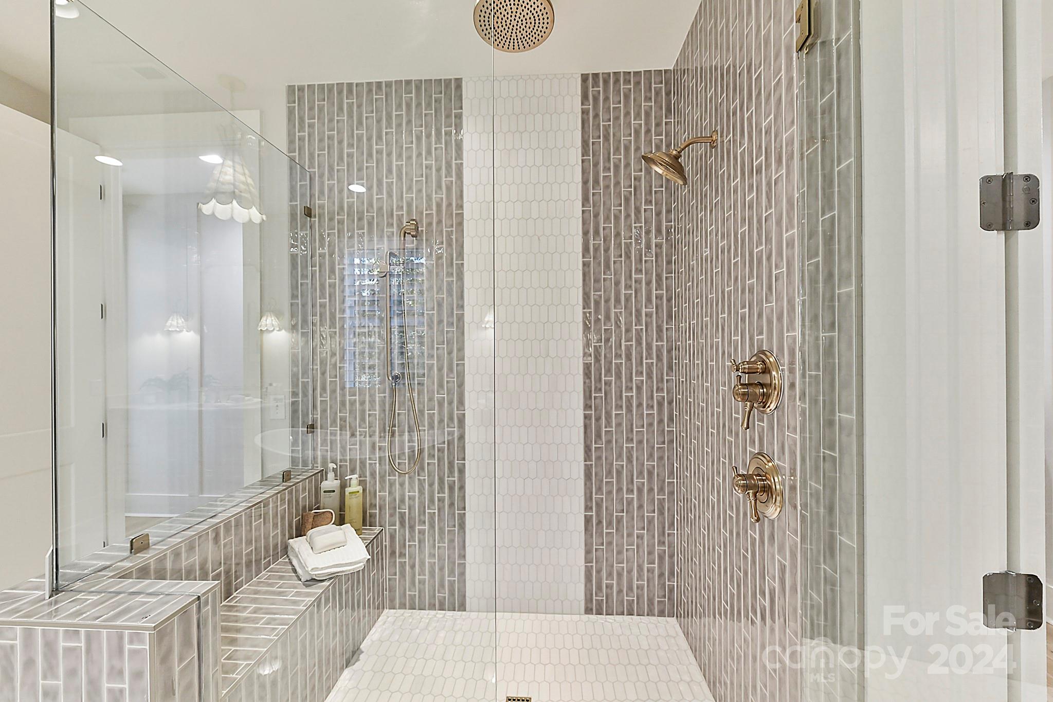 335 Bubbling Well Road Matthews, NC 28105 - Photo 19 of 48 a bathroom with a shower toilet and sink