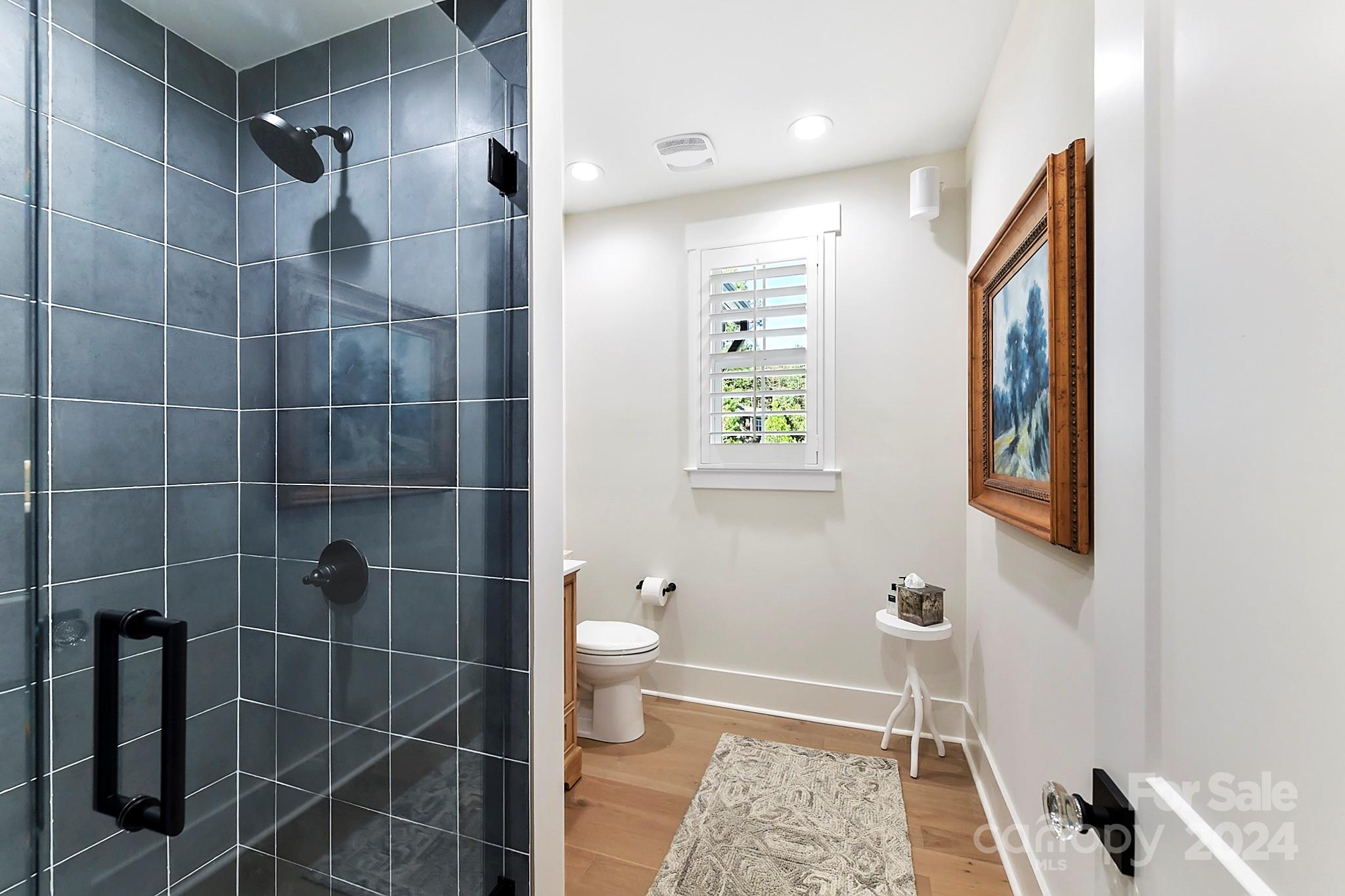 335 Bubbling Well Road Matthews, NC 28105 - Photo 25 of 48 a bathroom with a toilet and a shower