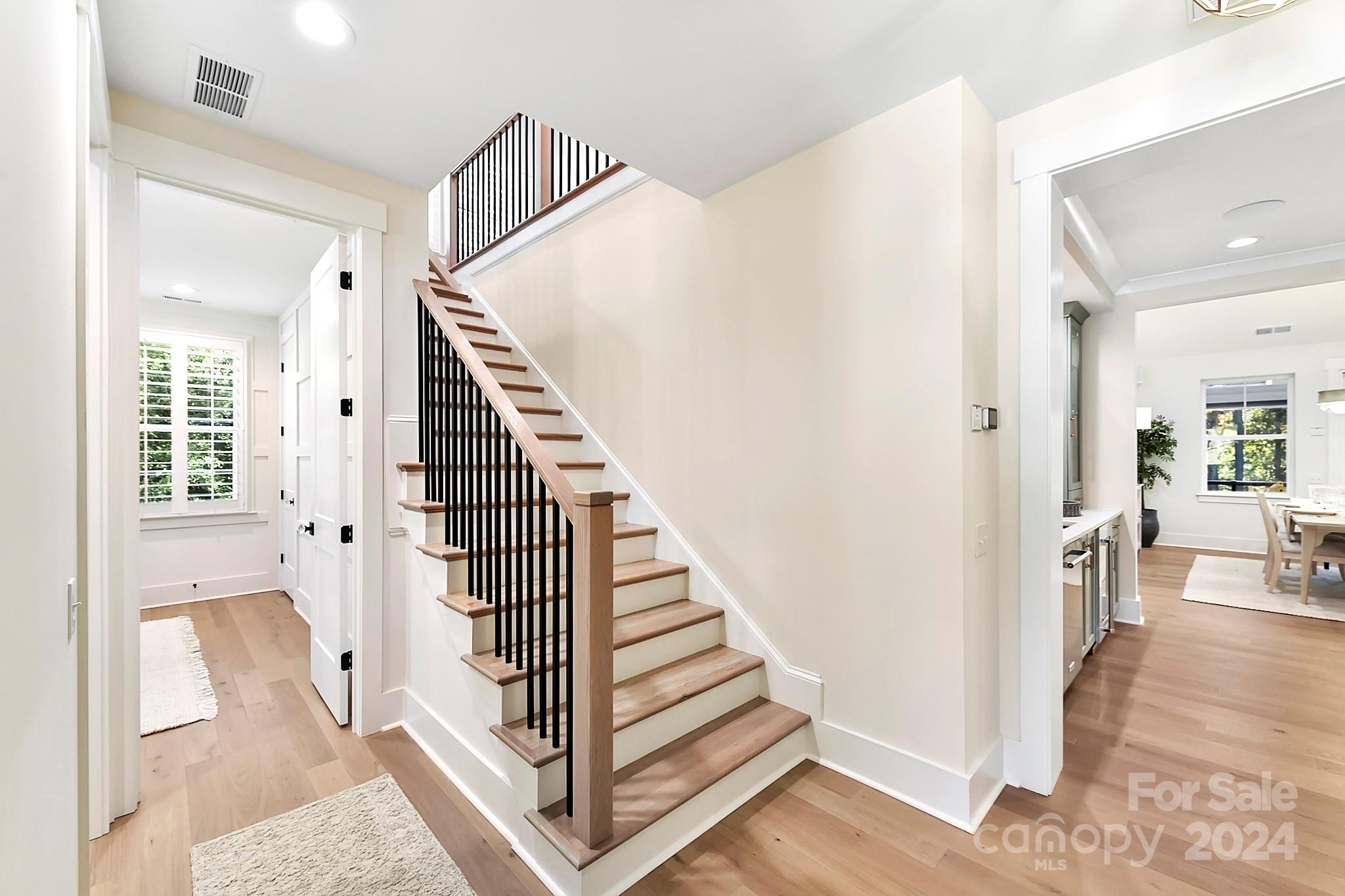 335 Bubbling Well Road Matthews, NC 28105 - Photo 26 of 48 a view of a hallway with wooden floor and entryway