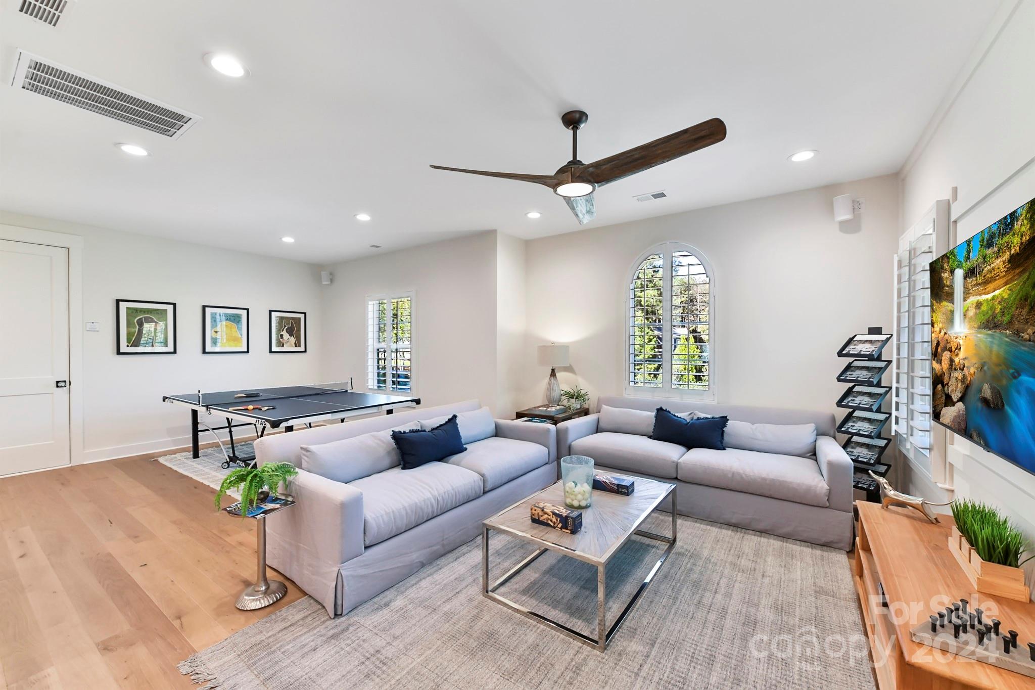 335 Bubbling Well Road Matthews, NC 28105 - Photo 28 of 48 a living room with furniture and a flat screen tv