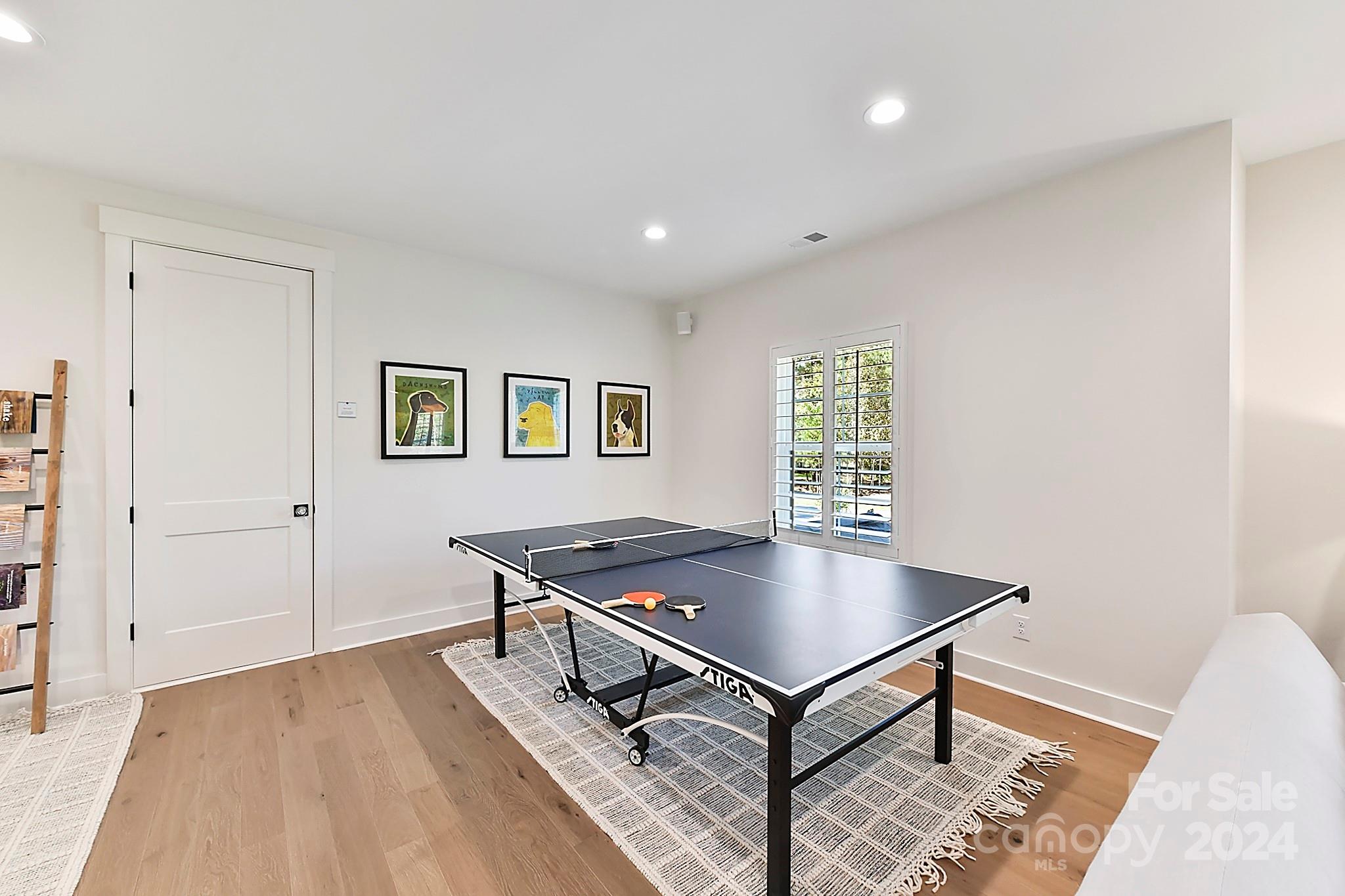 335 Bubbling Well Road Matthews, NC 28105 - Photo 29 of 48 a living room with furniture pool table and a window