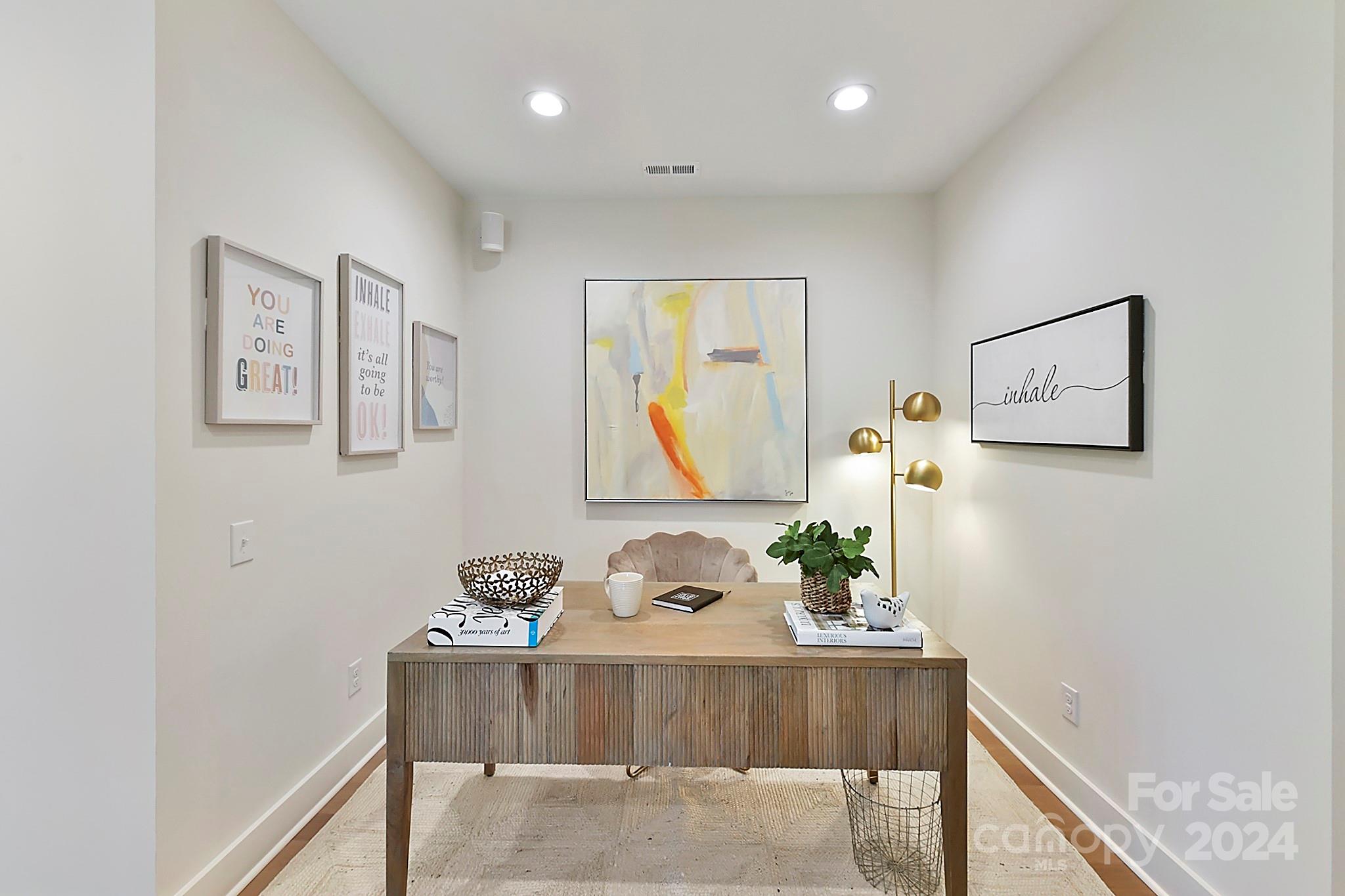 335 Bubbling Well Road Matthews, NC 28105 - Photo 33 of 48 a view of a hallway with furniture and wooden floor