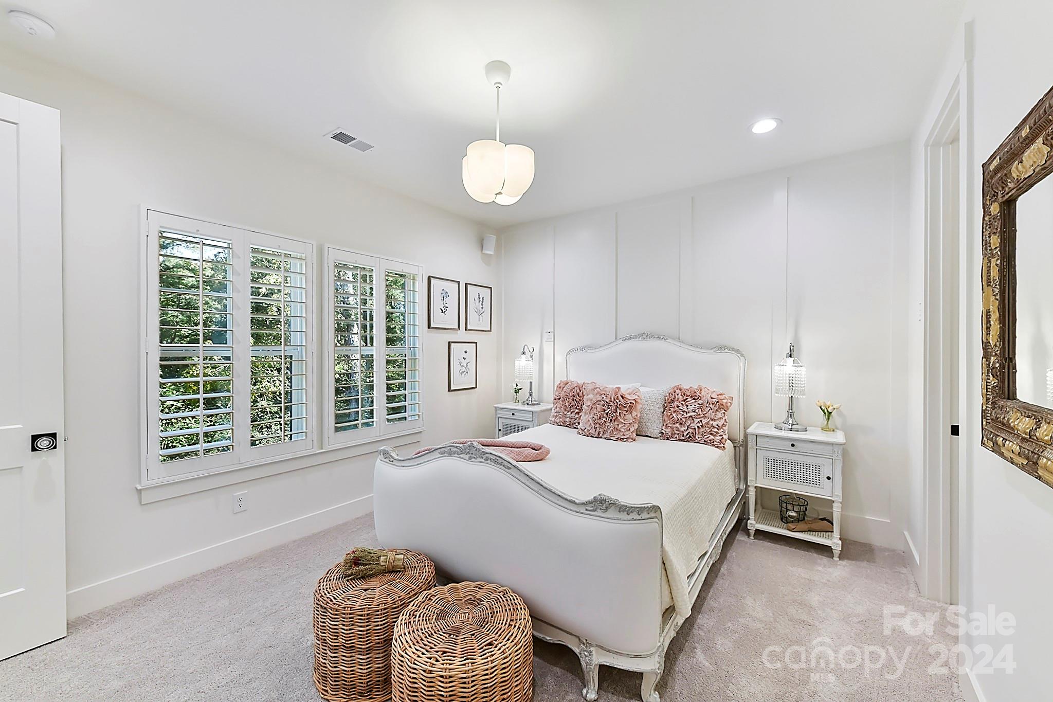 335 Bubbling Well Road Matthews, NC 28105 - Photo 35 of 48 a bedroom with a bed and a window