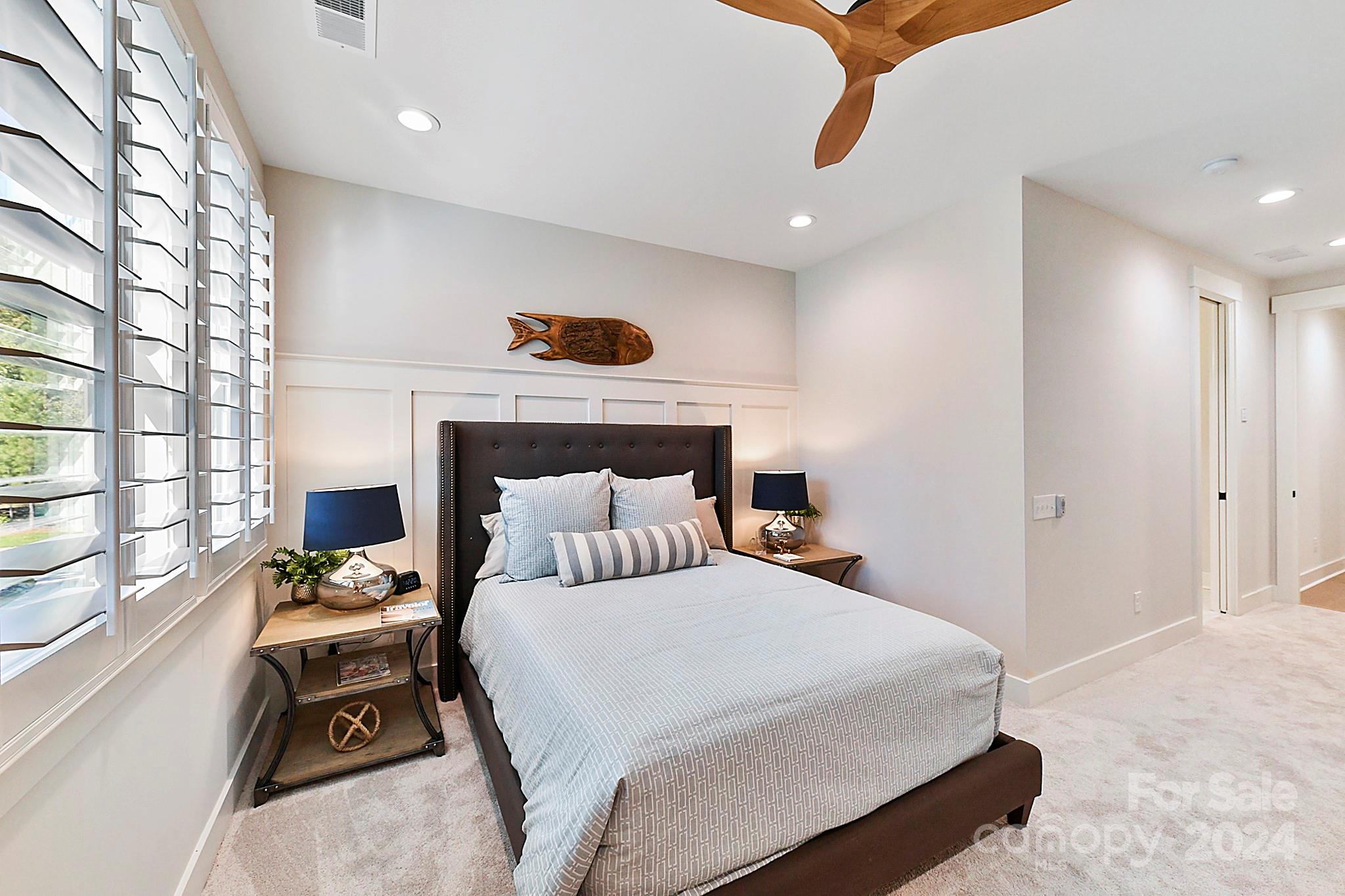 335 Bubbling Well Road Matthews, NC 28105 - Photo 38 of 48 a bedroom with a bed and wooden floor