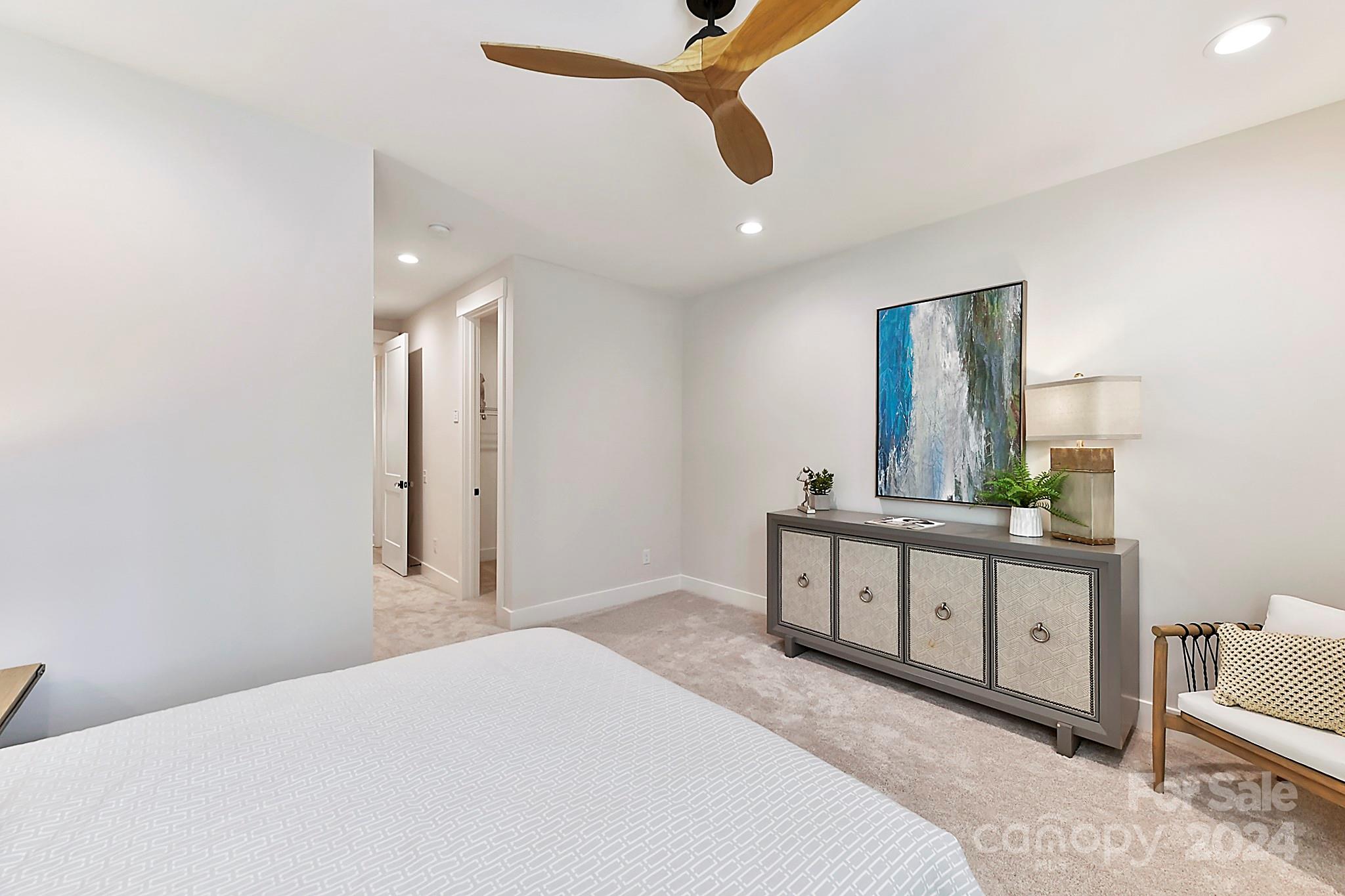 335 Bubbling Well Road Matthews, NC 28105 - Photo 39 of 48 a bedroom with a bed and a dresser