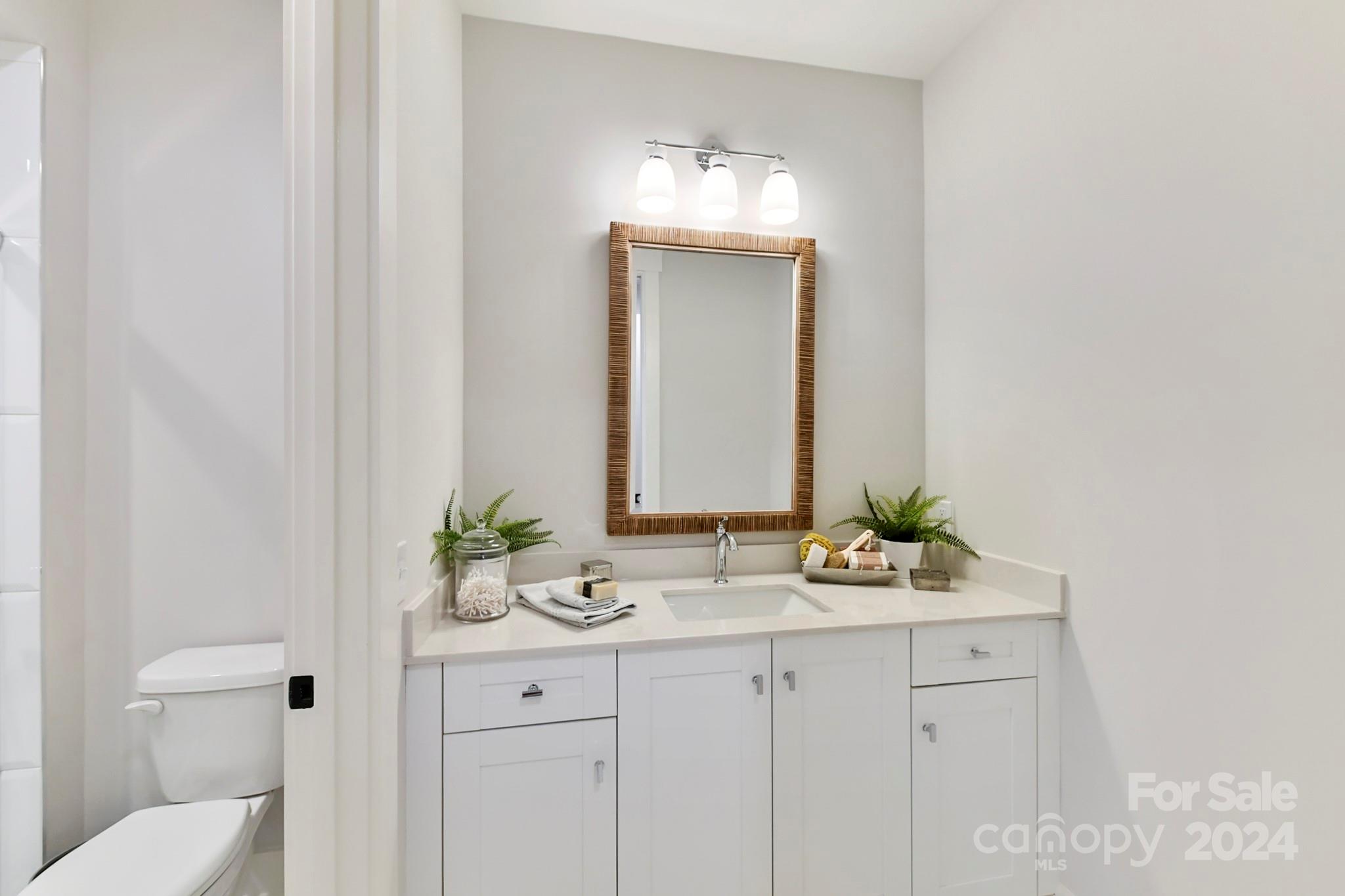 335 Bubbling Well Road Matthews, NC 28105 - Photo 40 of 48 a bathroom with mirror sink and vanity