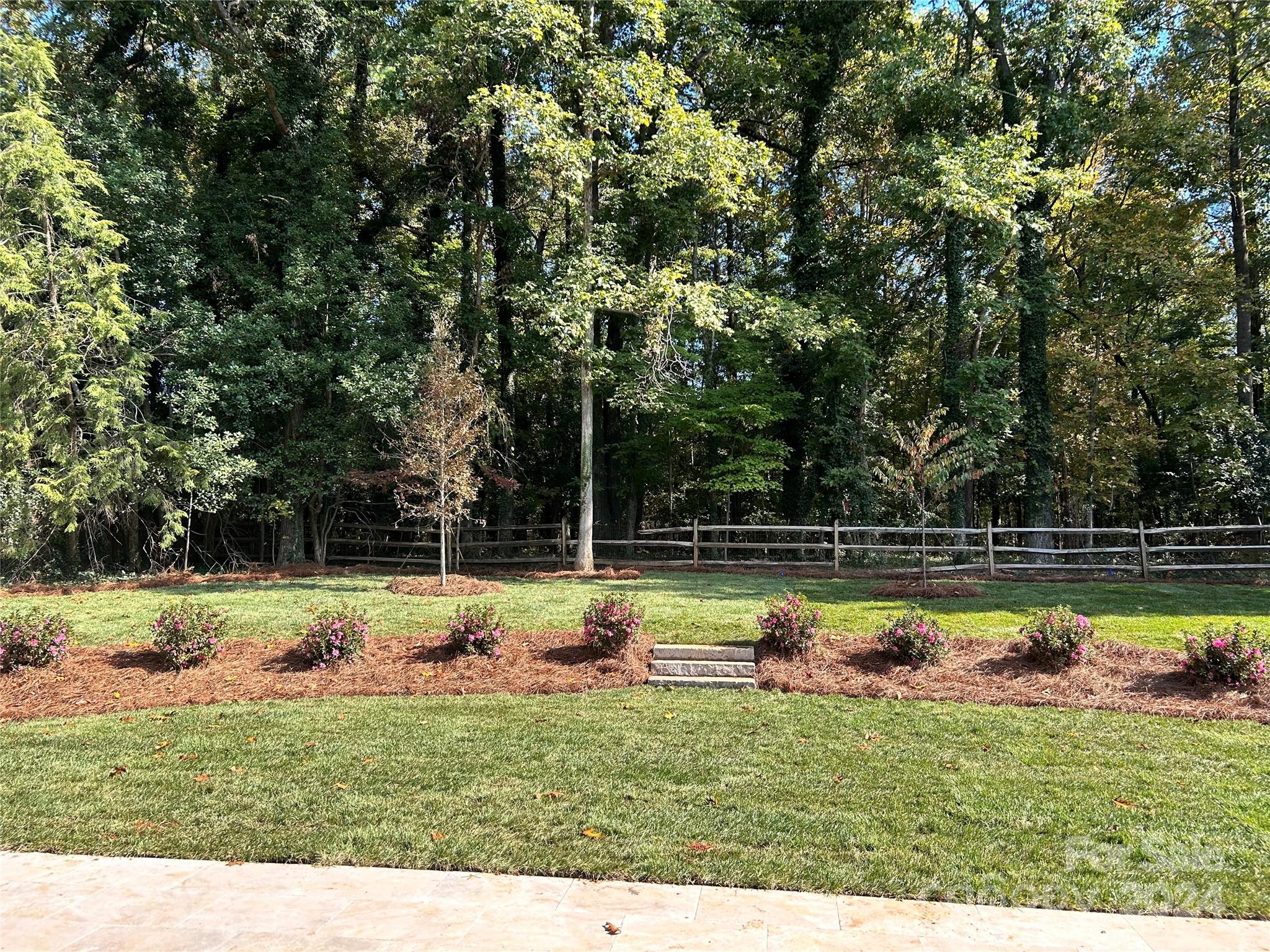 335 Bubbling Well Road Matthews, NC 28105 - Photo 48 of 48 a view of a backyard with swimming pool