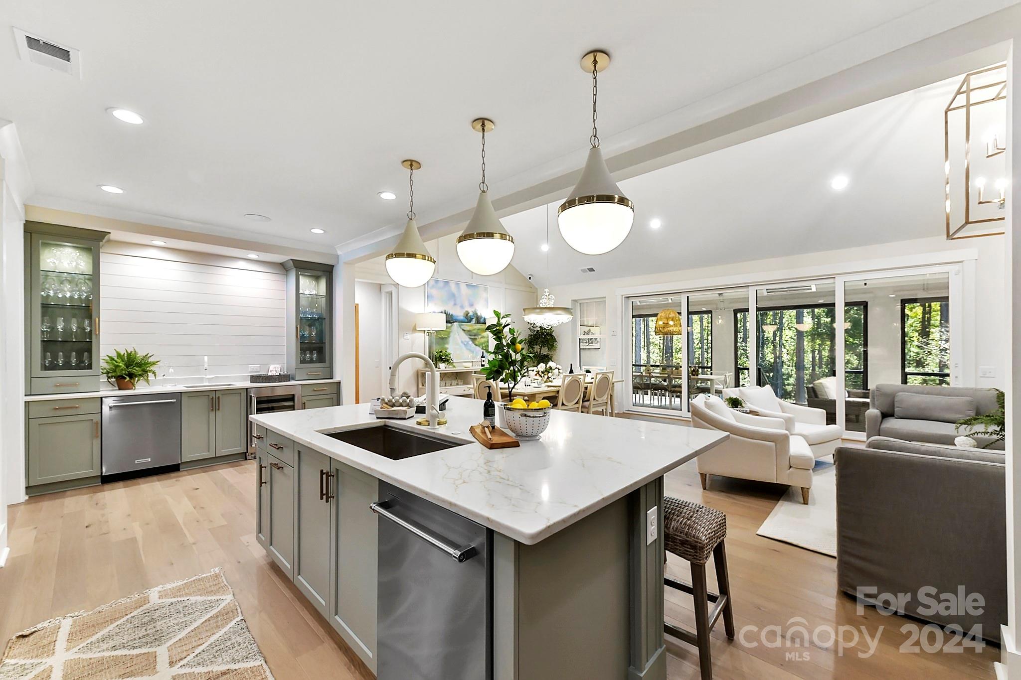 335 Bubbling Well Road Matthews, NC 28105 - Photo 6 of 48 a kitchen with counter space appliances and a view of living room