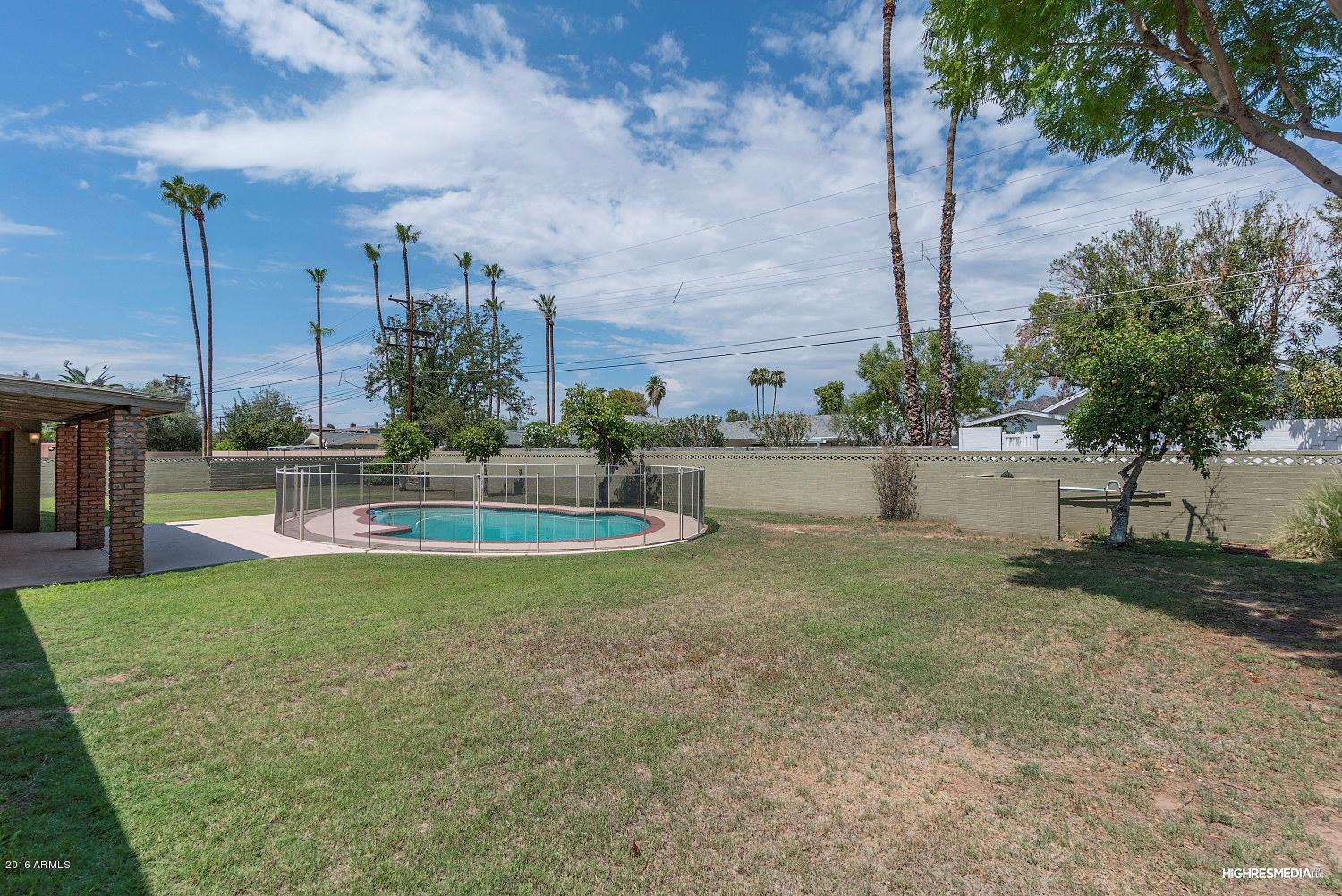 3424 East Camelback Road Phoenix, AZ 85018 - Photo 24 of 27 a view of a fountain in front of a house