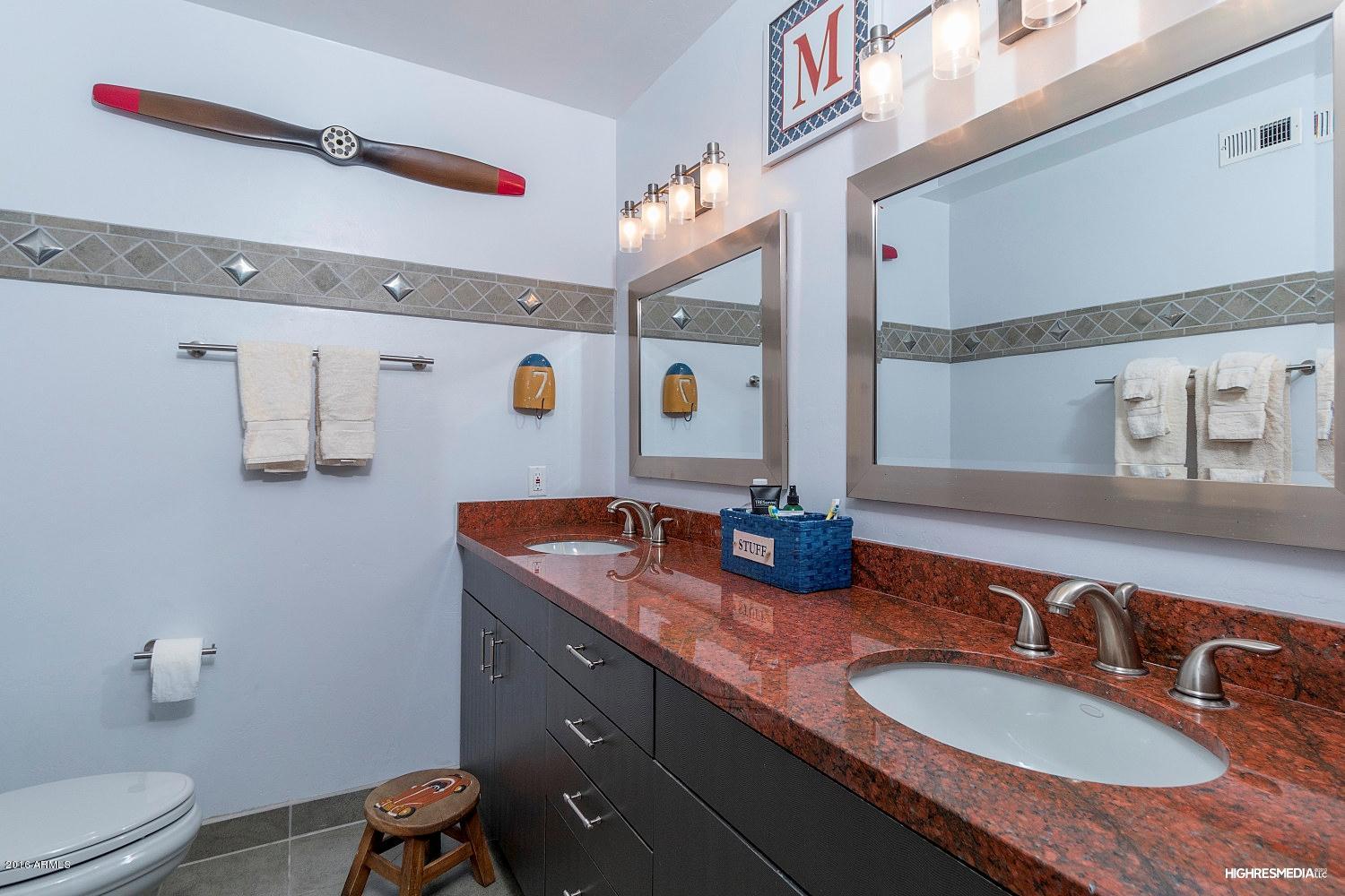 3424 East Camelback Road Phoenix, AZ 85018 - Photo 8 of 27 a bathroom with a granite countertop double vanity sink and mirror
