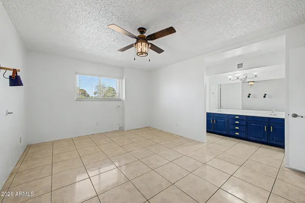 a spacious bathroom with a double vanity sink mirror and double