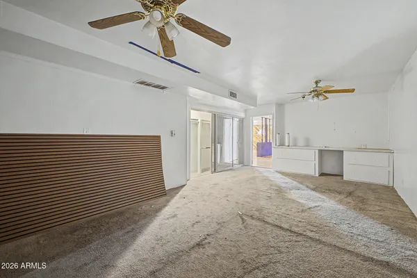 a bathroom with a toilet sink and shower