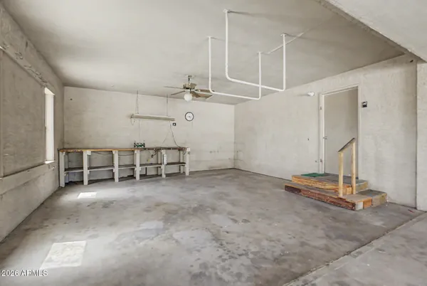 a view of a dry yard with a house