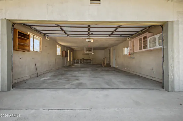 a view of a yard with snow on the road