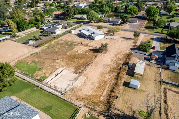 an aerial view of house with yard