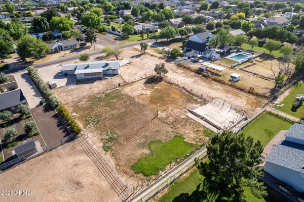 an aerial view of residential houses with outdoor space
