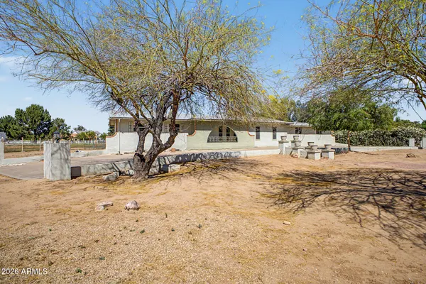 a view of a house with a snow in the yard