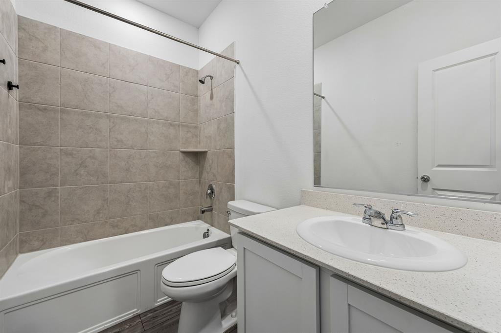 820 Carmen Street Forney, TX 75126 - Photo 21 of 25 a bathroom with a sink toilet and shower