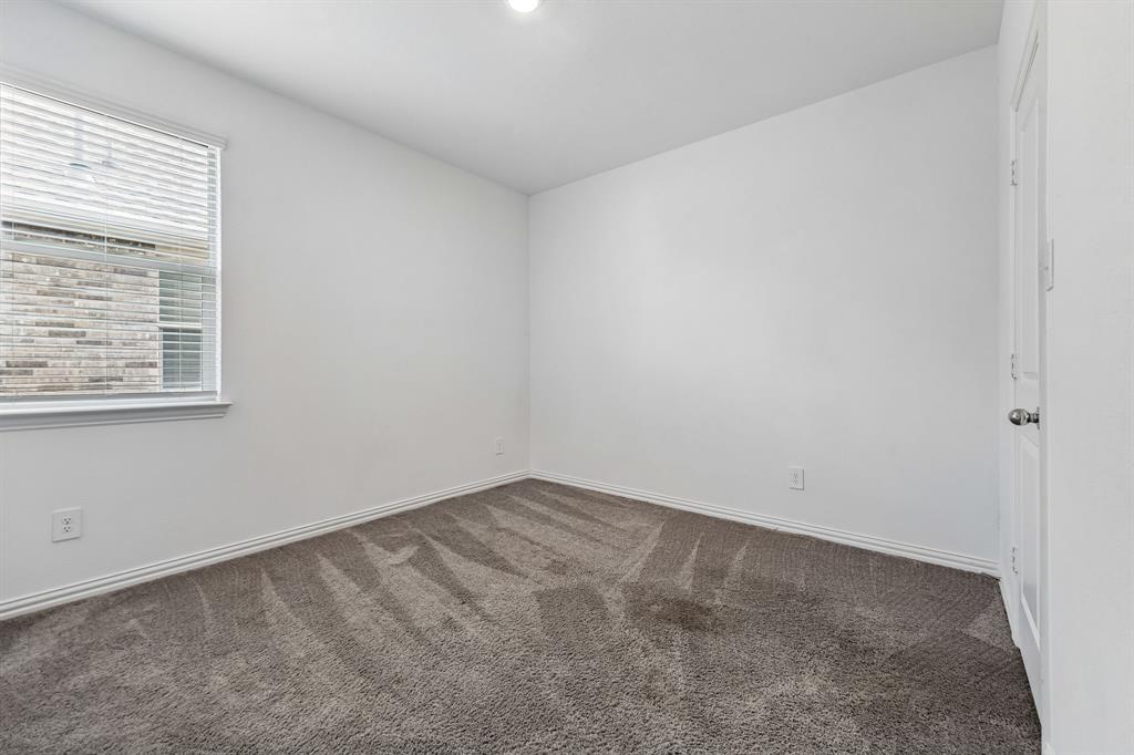 820 Carmen Street Forney, TX 75126 - Photo 22 of 25 an empty room with a window