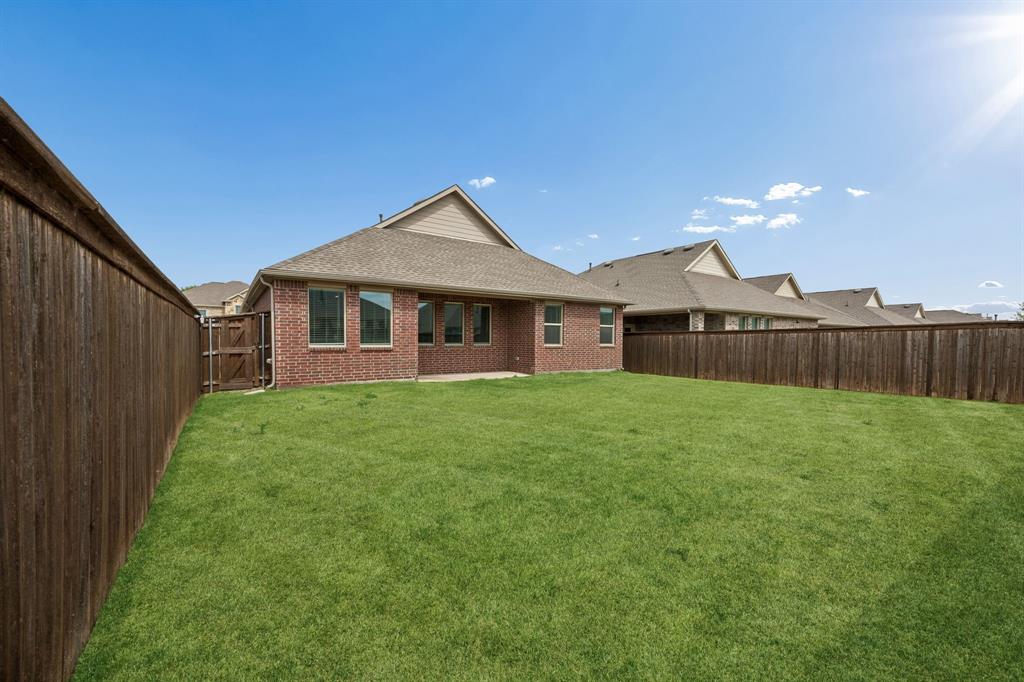 820 Carmen Street Forney, TX 75126 - Photo 25 of 25 a view of a house with a yard
