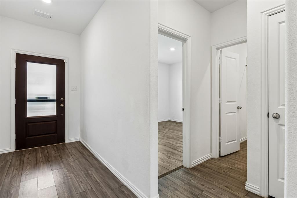 820 Carmen Street Forney, TX 75126 - Photo 3 of 25 a view of hallway with wooden floor