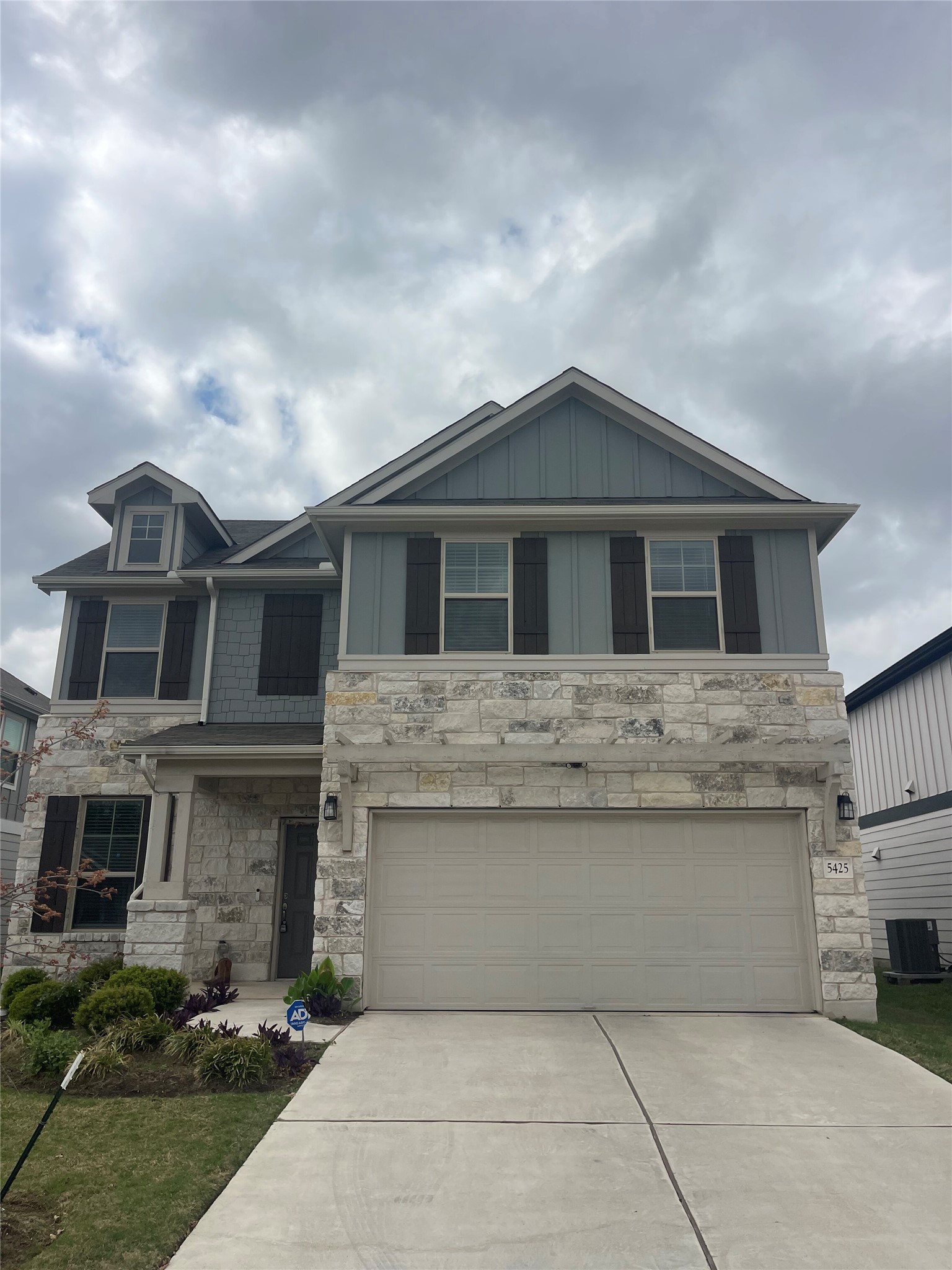 5425 Durango Pass Austin, TX 78724 - Photo 1 of 31 View of front of property with concrete driveway, stone siding, board and batten siding, and an attached garage