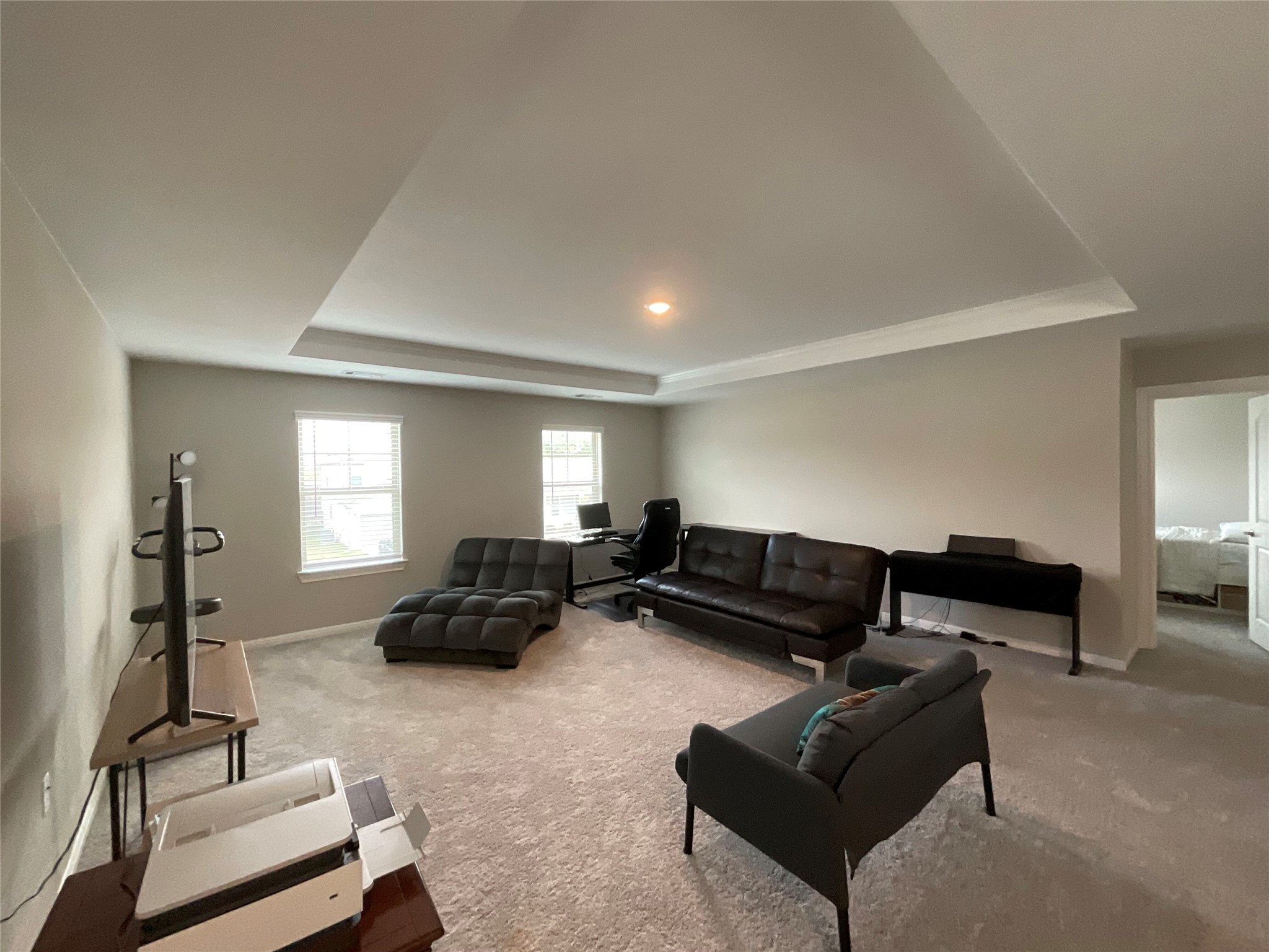 5425 Durango Pass Austin, TX 78724 - Photo 16 of 31 Living area with recessed lighting, and a tray ceiling
