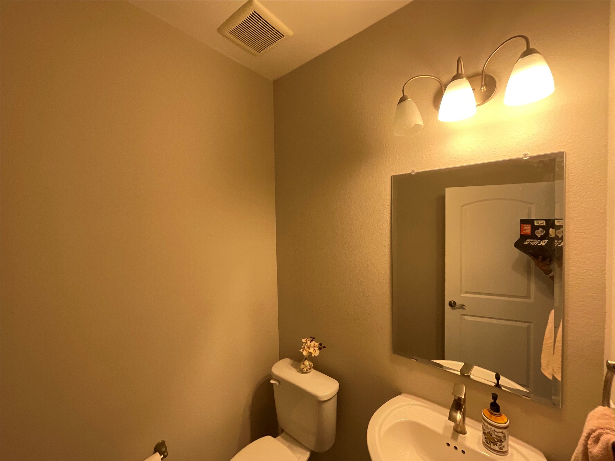 5425 Durango Pass Austin, TX 78724 - Photo 27 of 31 Half bathroom featuring toilet and a sink