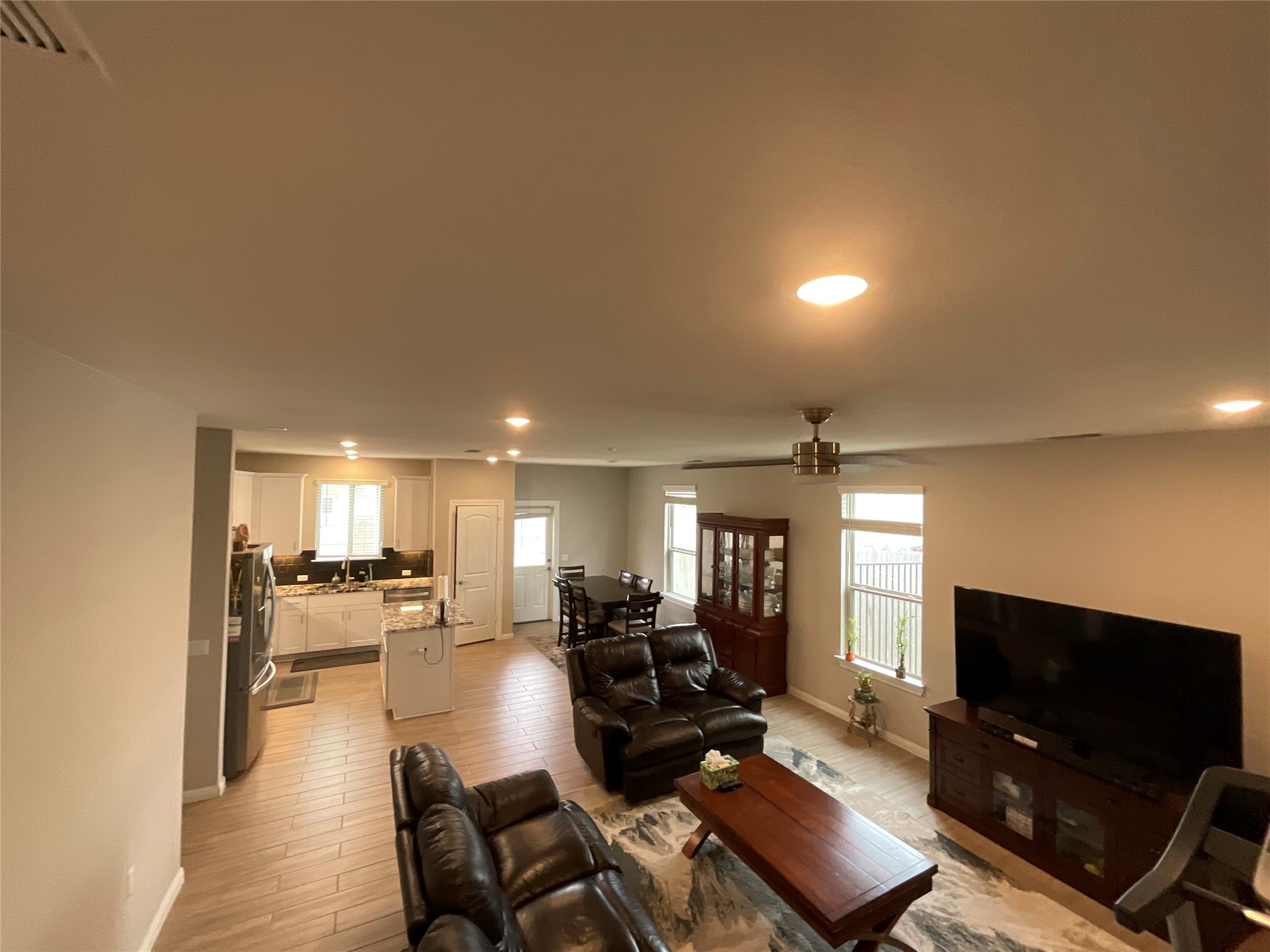 5425 Durango Pass Austin, TX 78724 - Photo 4 of 31 Living room featuring recessed lighting, healthy amount of natural light, ceiling fan, and light wood-type flooring