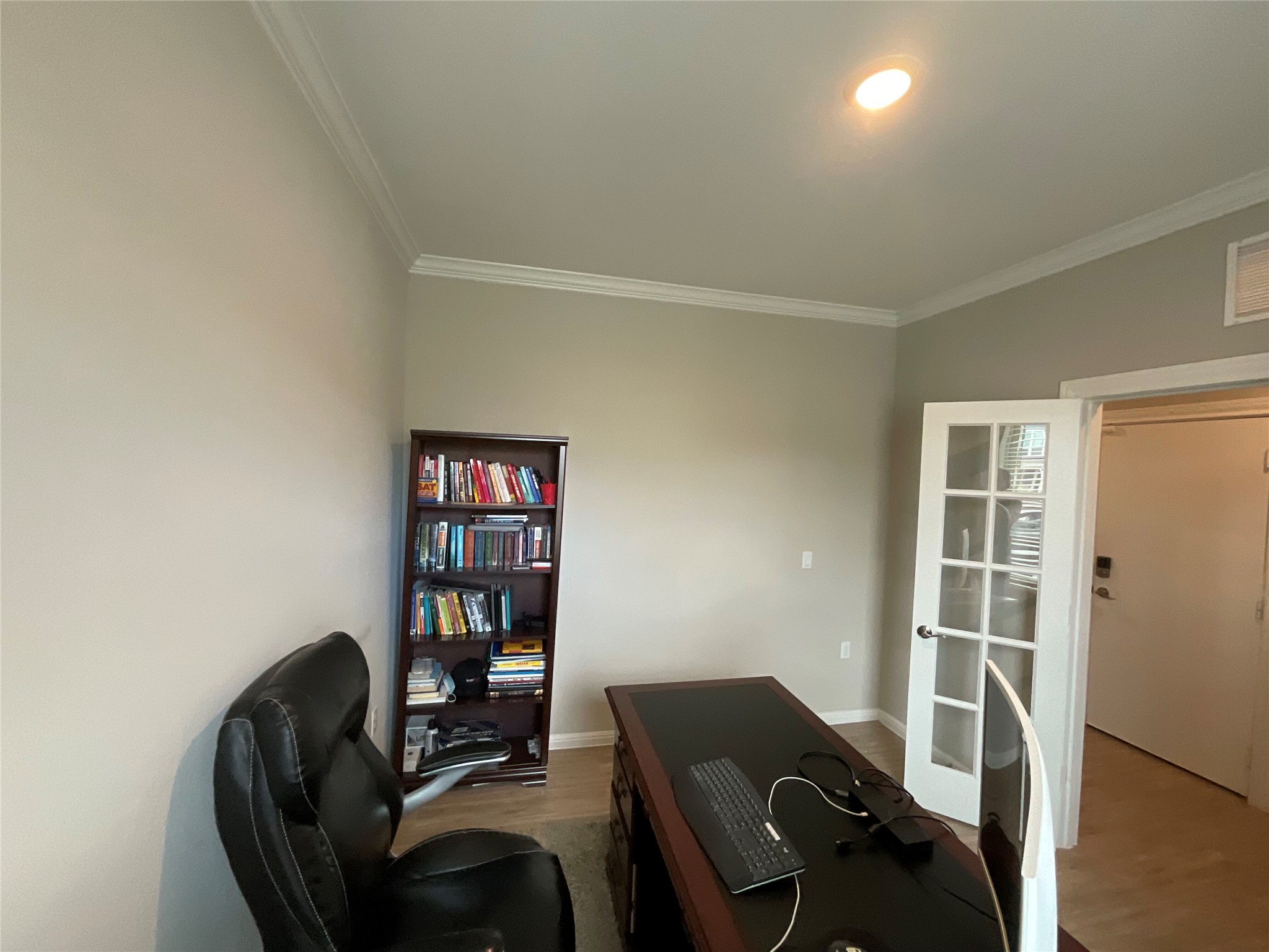 5425 Durango Pass Austin, TX 78724 - Photo 8 of 31 Office with crown molding and light wood-style floors