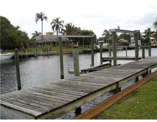 120 Northwest S Shore Road Stuart, FL 34994 - Photo 16 of 16 a view of houses with outdoor space