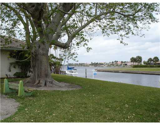 120 Northwest S Shore Road Stuart, FL 34994 - Photo 2 of 16 a view of a lake with a garden