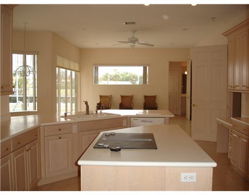 120 Northwest S Shore Road Stuart, FL 34994 - Photo 5 of 16 a living room with furniture a large window and flat screen tv
