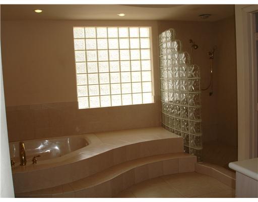 120 Northwest S Shore Road Stuart, FL 34994 - Photo 9 of 16 a bathroom with a bathtub and shower