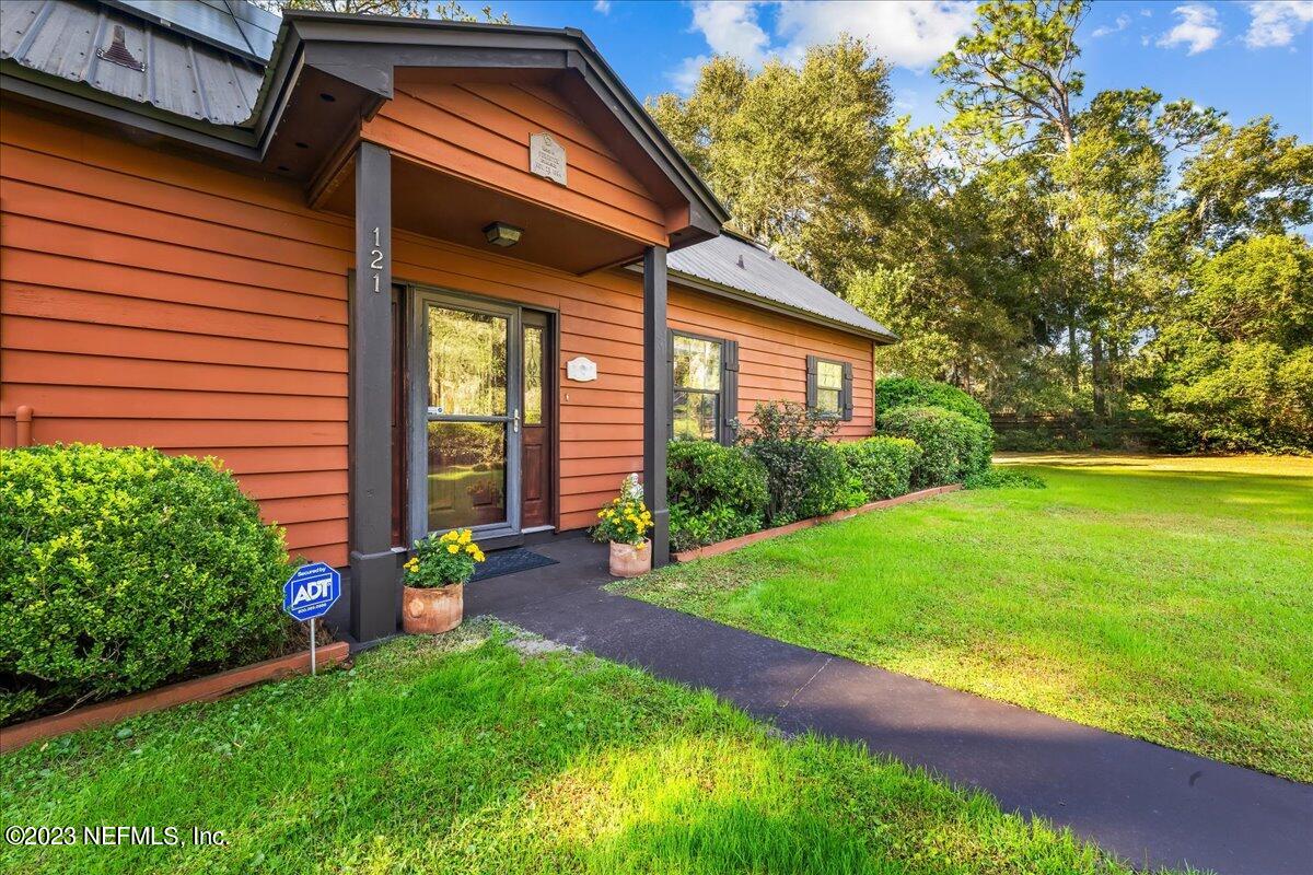 121 Peniel Church Road Palatka, FL 32177 - Photo 19 of 81 a front view of a house with garden