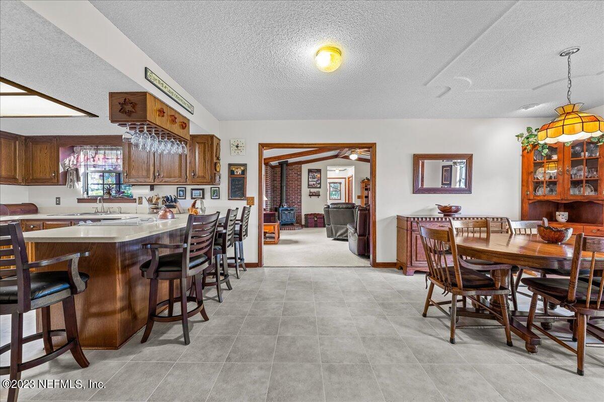 121 Peniel Church Road Palatka, FL 32177 - Photo 26 of 81 a view of a dining room with furniture and a chandelier