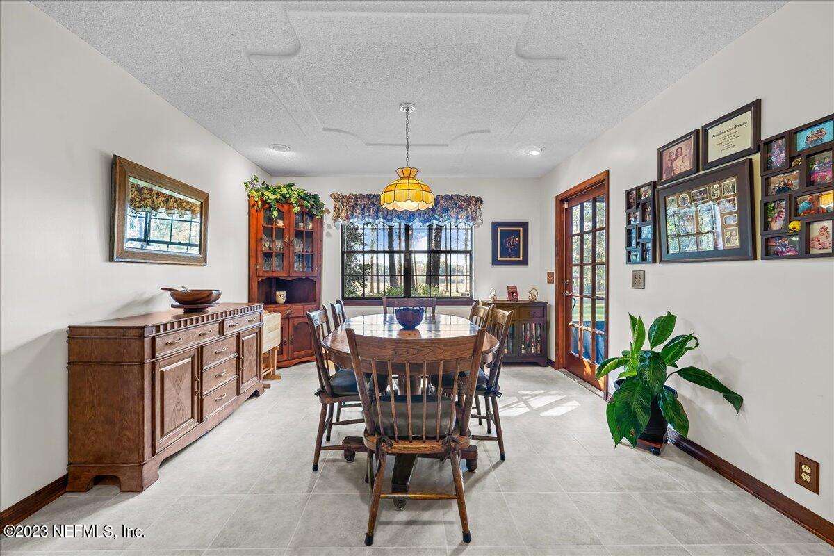 121 Peniel Church Road Palatka, FL 32177 - Photo 27 of 81 a view of a dining room with furniture window and flowerpot