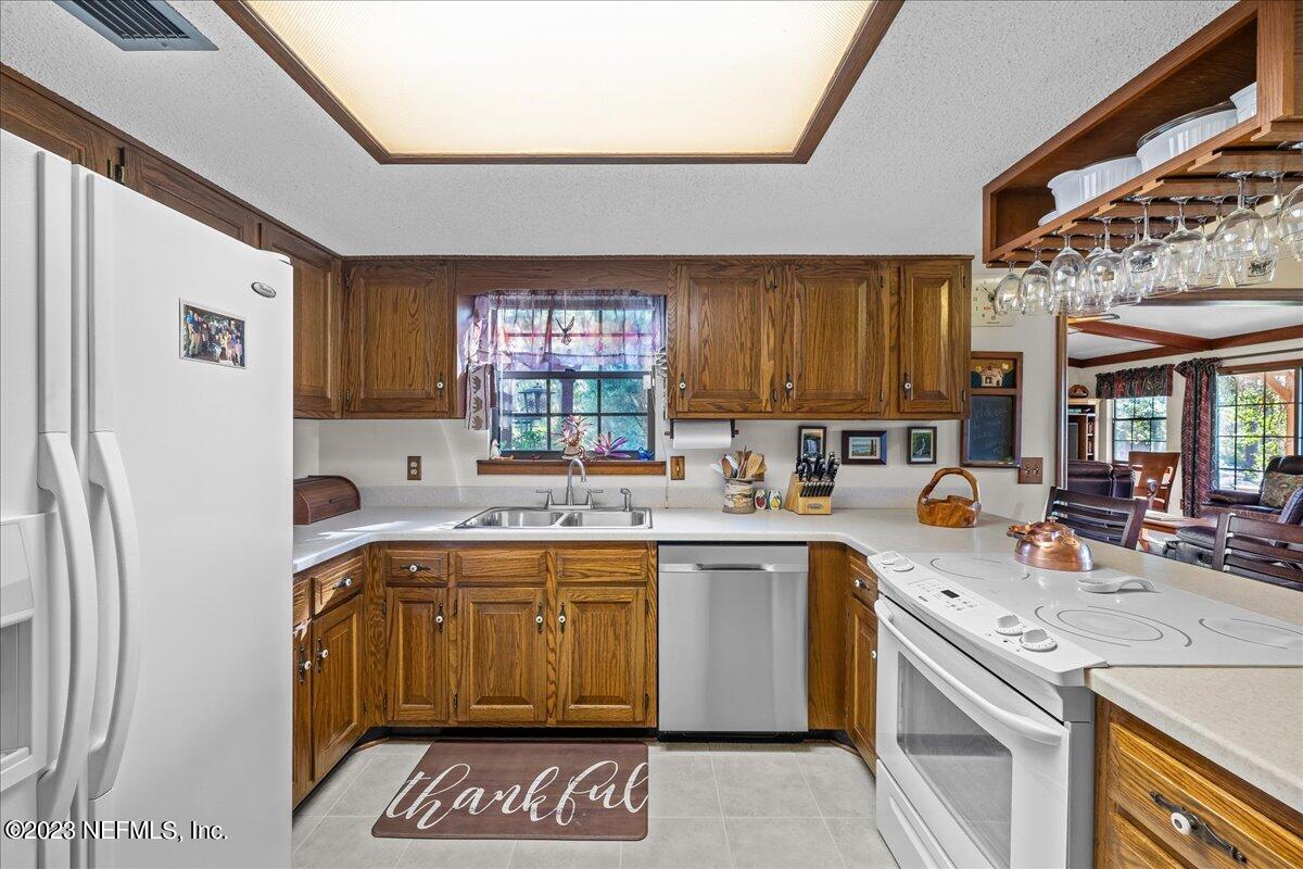 121 Peniel Church Road Palatka, FL 32177 - Photo 30 of 81 a kitchen with a sink stove and cabinets
