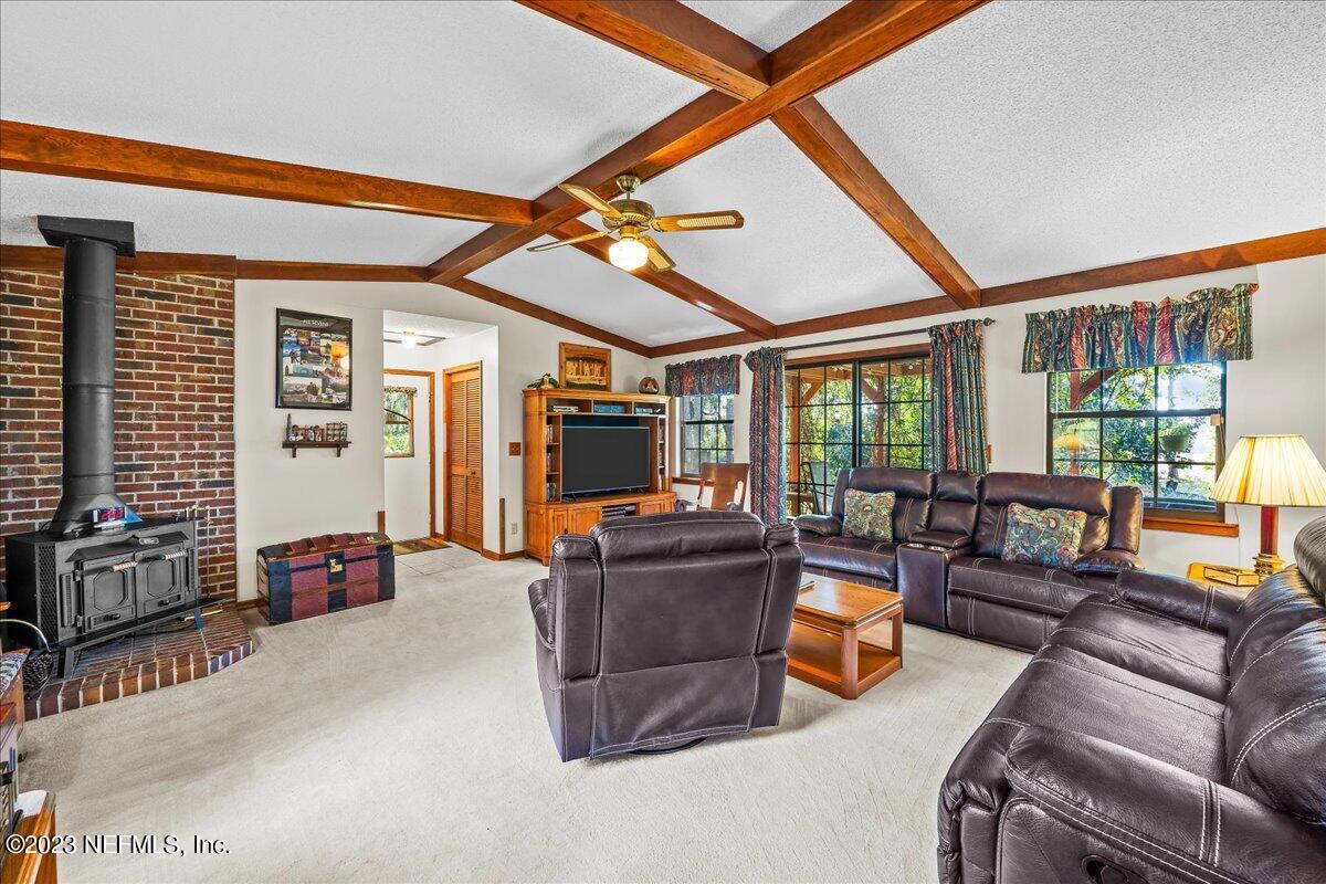 121 Peniel Church Road Palatka, FL 32177 - Photo 32 of 81 a living room with furniture and a flat screen tv