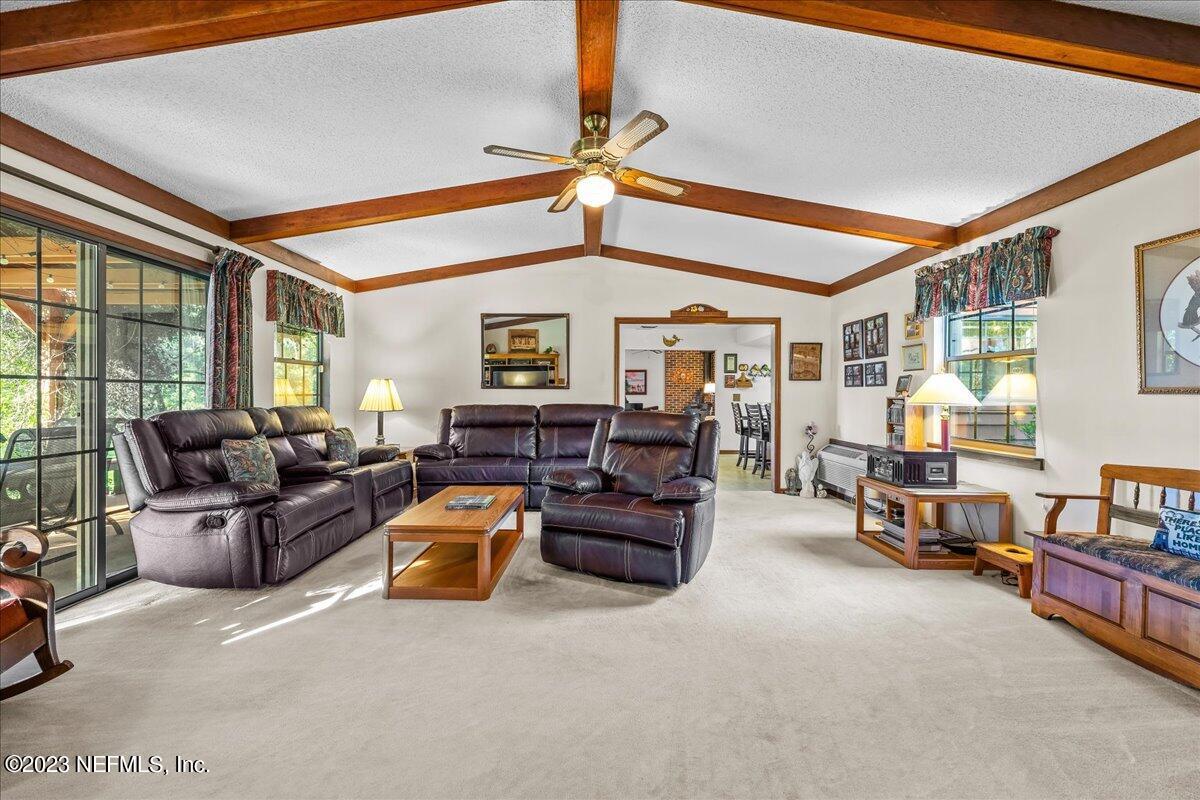 121 Peniel Church Road Palatka, FL 32177 - Photo 33 of 81 a living room with furniture and a chandelier