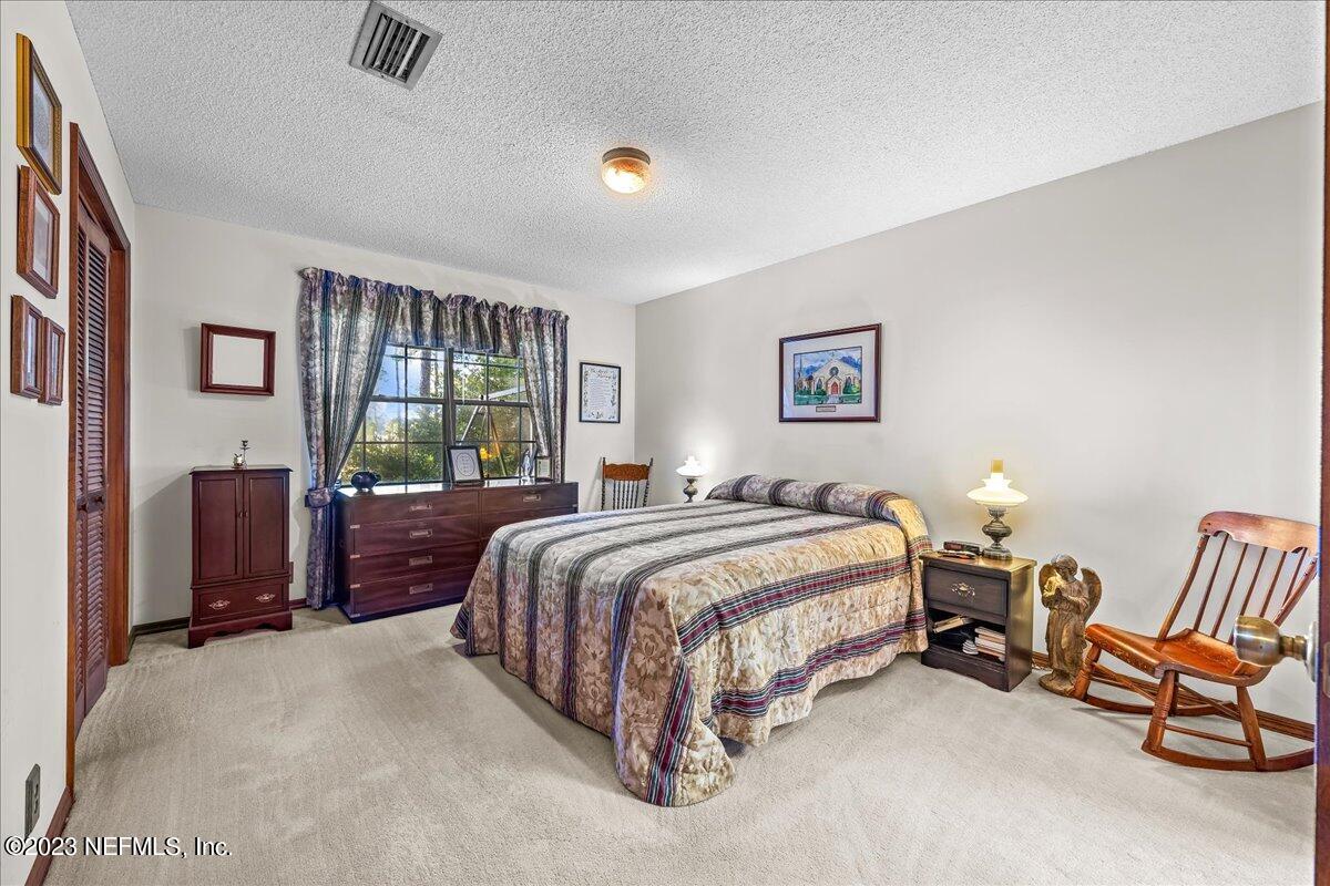 121 Peniel Church Road Palatka, FL 32177 - Photo 36 of 81 a spacious bedroom with a bed and a window