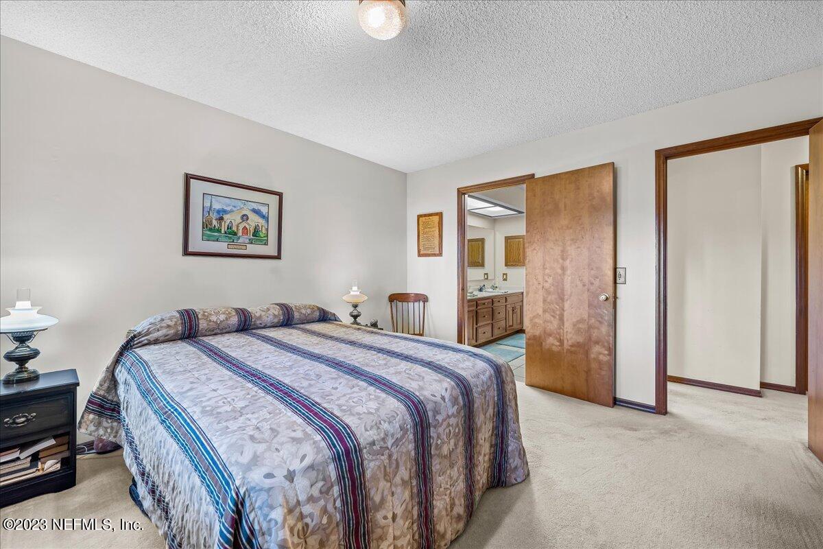 121 Peniel Church Road Palatka, FL 32177 - Photo 37 of 81 a spacious bedroom with a bed and a desk