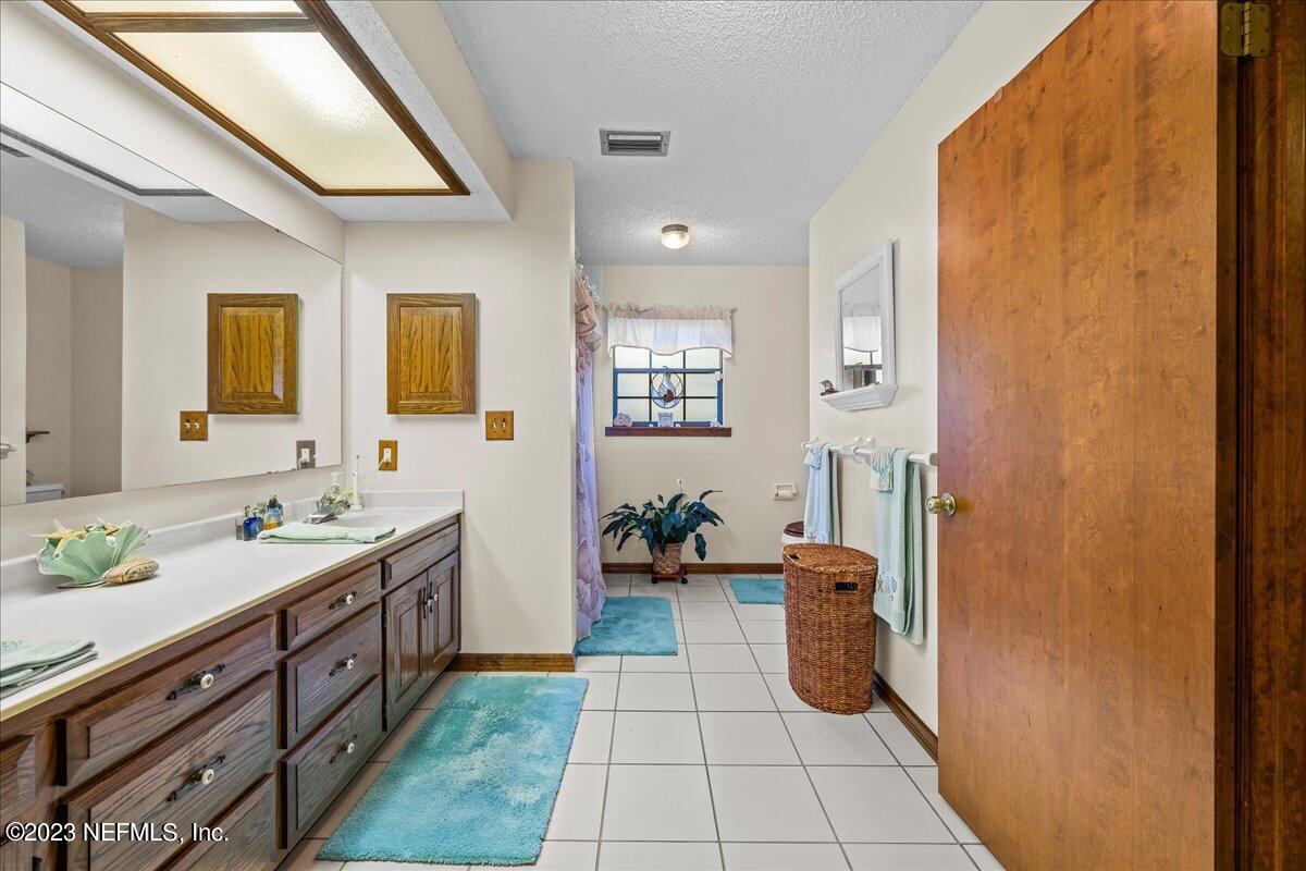121 Peniel Church Road Palatka, FL 32177 - Photo 38 of 81 a bathroom with a sink a toilet and mirror
