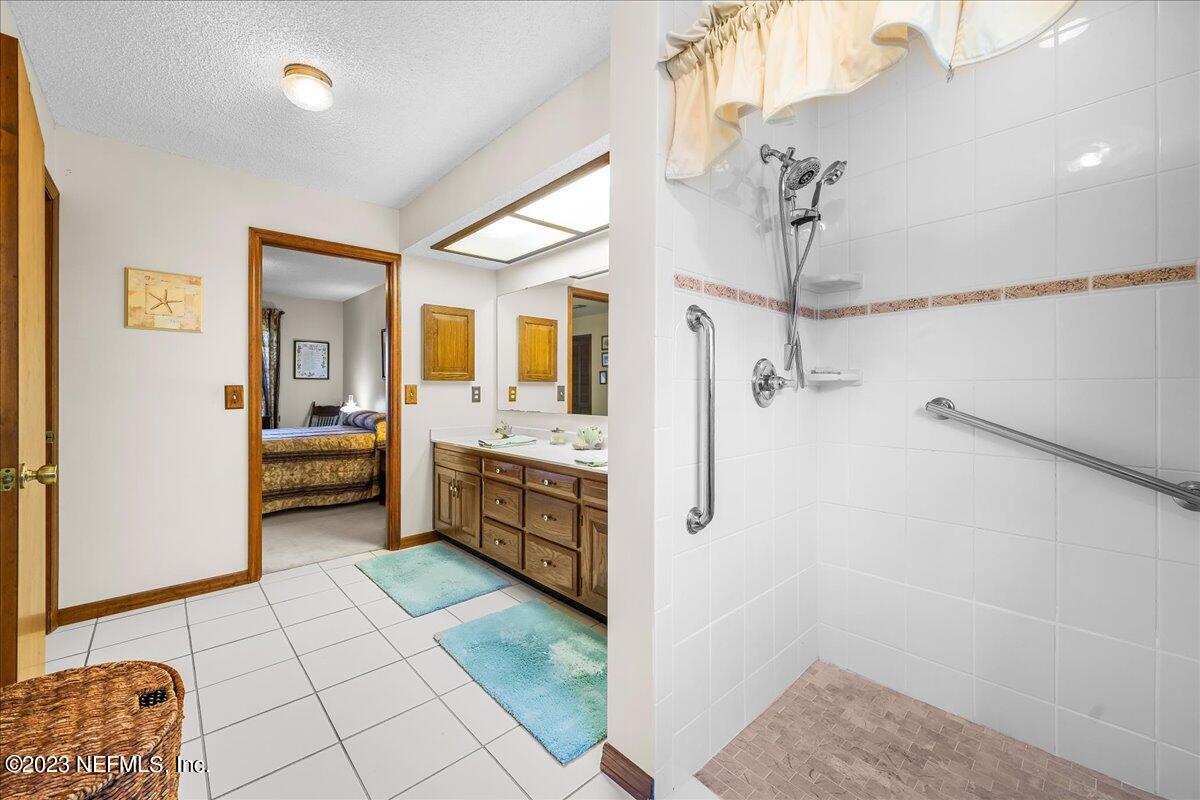 121 Peniel Church Road Palatka, FL 32177 - Photo 39 of 81 a bathroom with a sink a mirror and shower