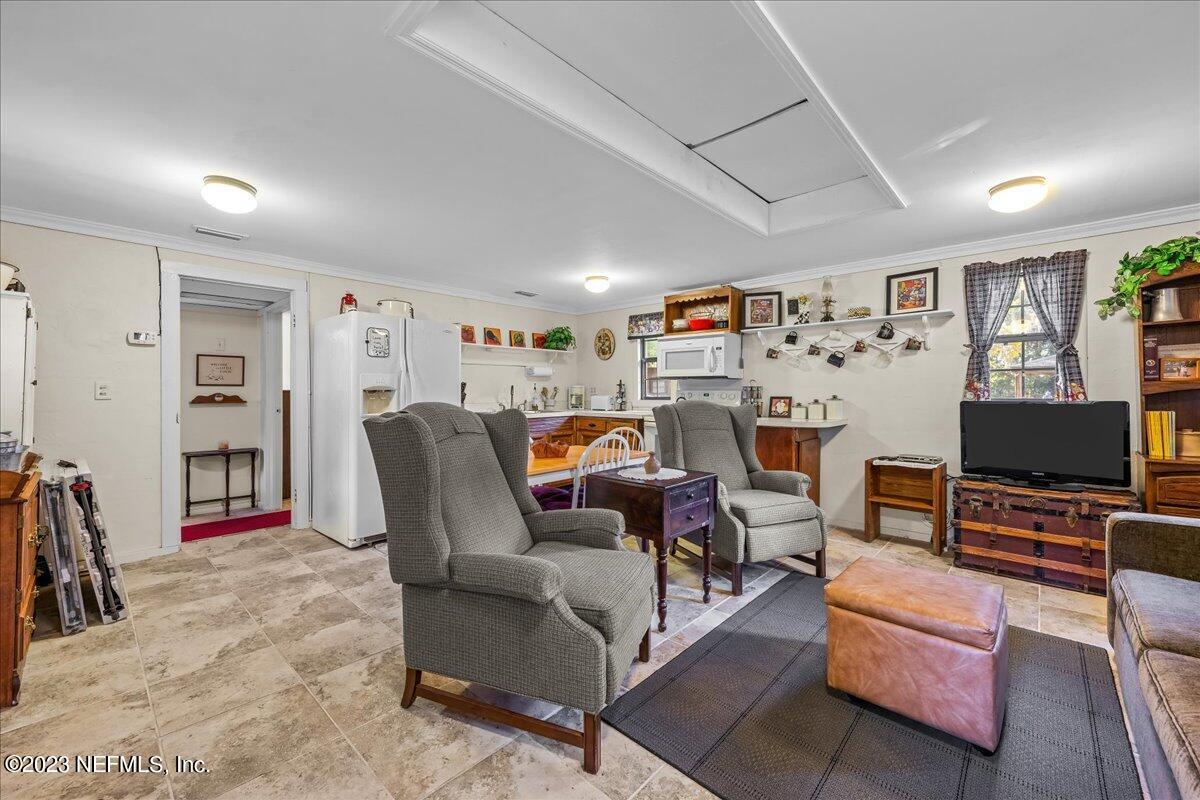 121 Peniel Church Road Palatka, FL 32177 - Photo 48 of 81 a living room with furniture and a flat screen tv