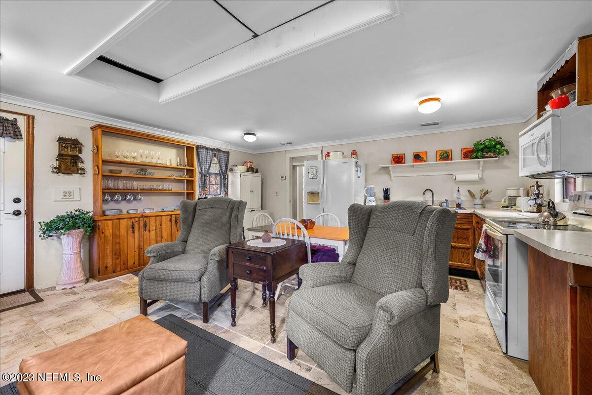 121 Peniel Church Road Palatka, FL 32177 - Photo 50 of 81 a living room with furniture and a flat screen tv