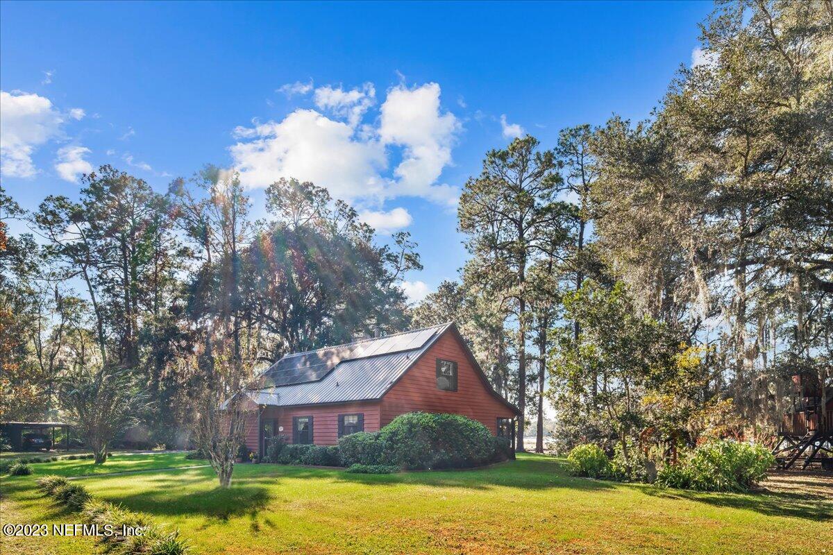 121 Peniel Church Road Palatka, FL 32177 - Photo 5 of 81 a view of a house with a yard and large trees