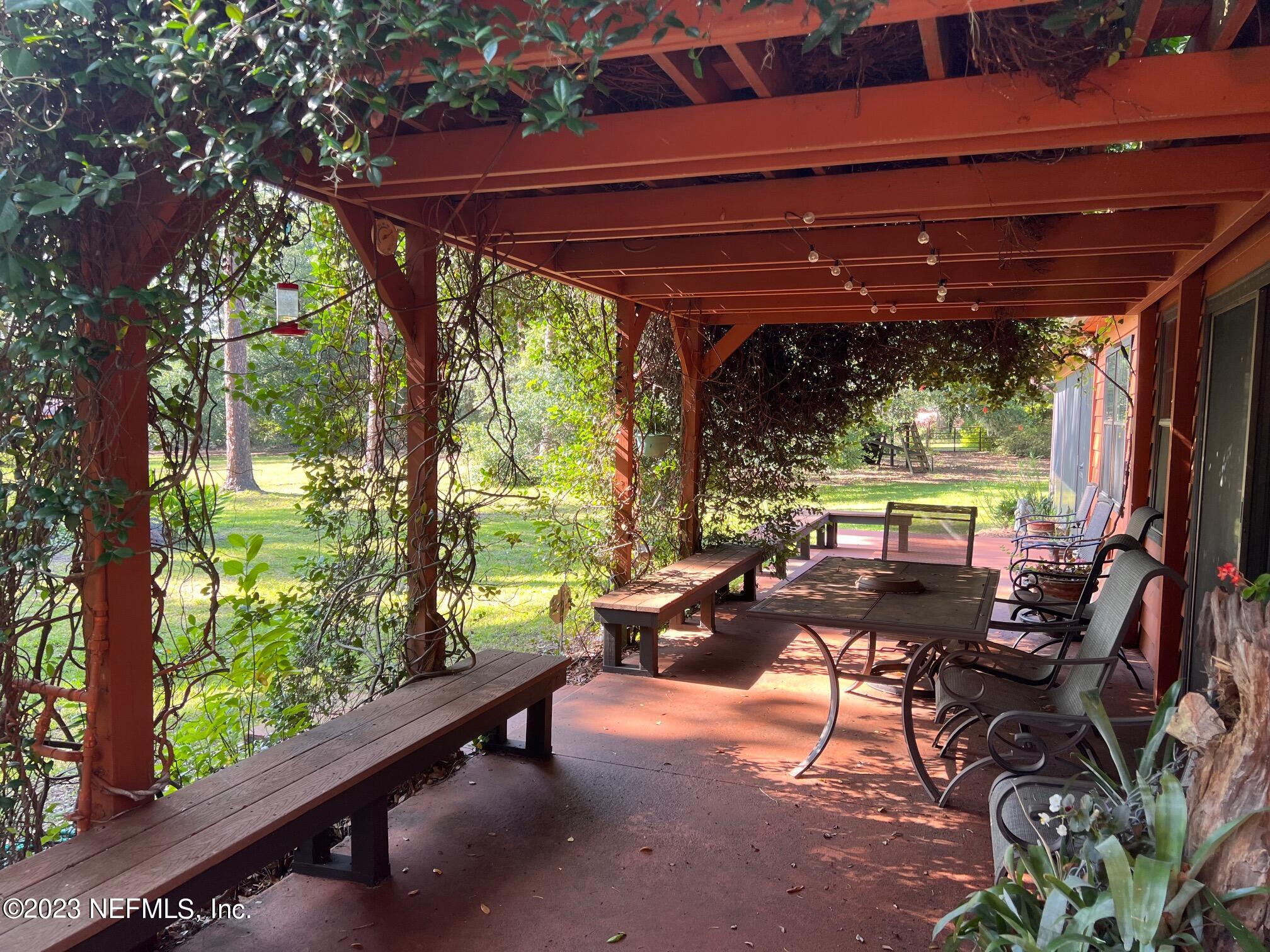 121 Peniel Church Road Palatka, FL 32177 - Photo 76 of 81 a view of a patio with chairs and a table