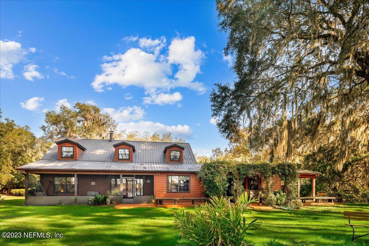121 Peniel Church Road Palatka, FL 32177 - Photo 9 of 81 a front view of a residential apartment building with a yard